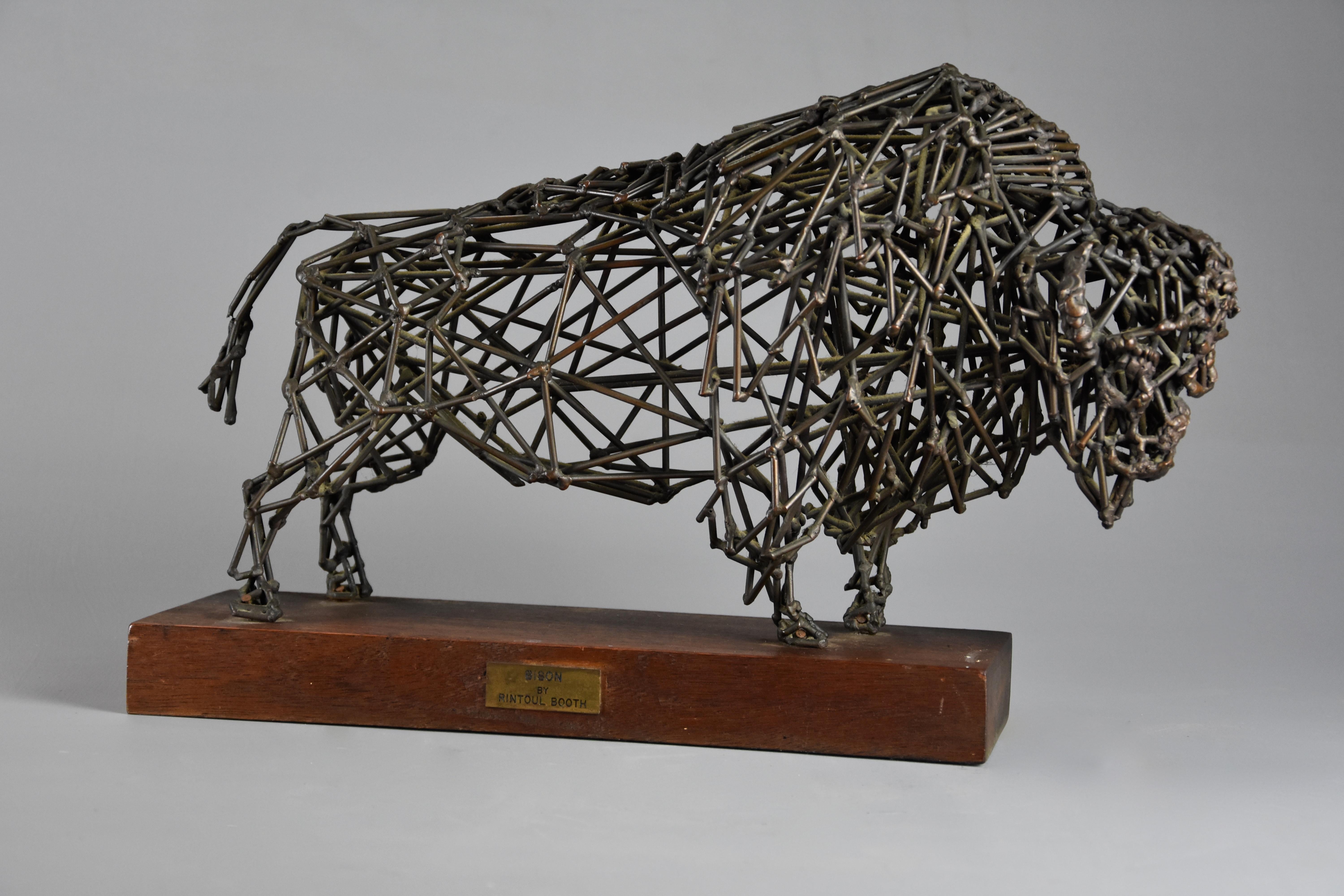A highly decorative bronze wirework sculpture of a ‘Bison' by Daniel Rintoul Booth (1932-1978).

This unusual wirework bronze portrays a broad and muscular bison, supported on teak wooden base with brass plaque.

The sculptor, Daniel Rintoul