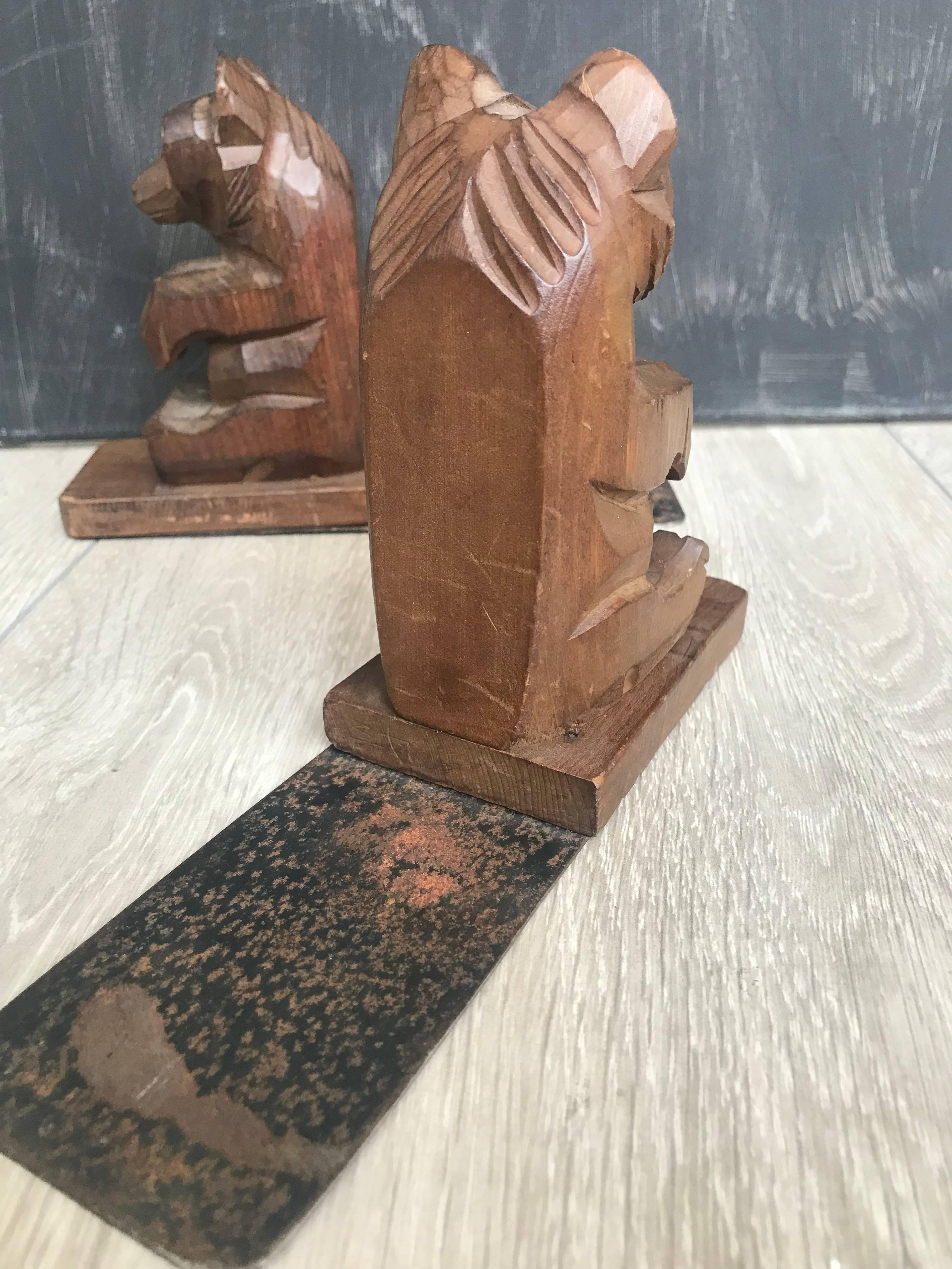 Rare and nice quality carved sitting bear bookstands. 

These hand-carved bears with their curiously looking eyes are beautiful in both shape and color and they are a joy to own and look at. It is as if they have just performed a trick and they are