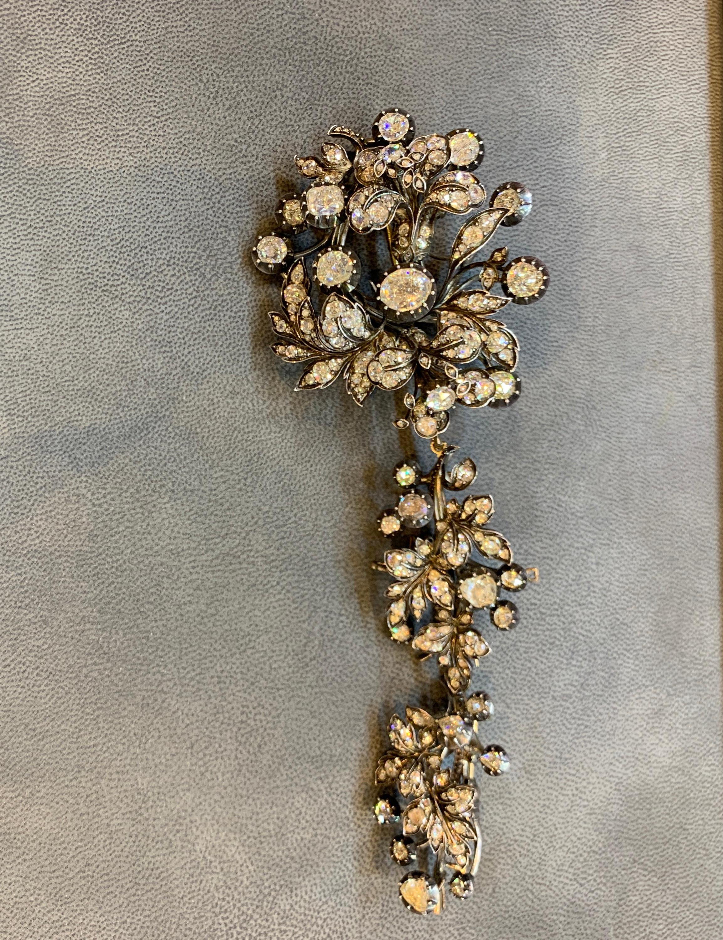 Antique Devant De Corsage Diamond Brooch
Set with approx 28 carats of rose cut diamonds mostly collet set.
Mounted in silver backed gold
Convertible to Three Smaller Brooches
Approx Measurements: 7 inches in length !