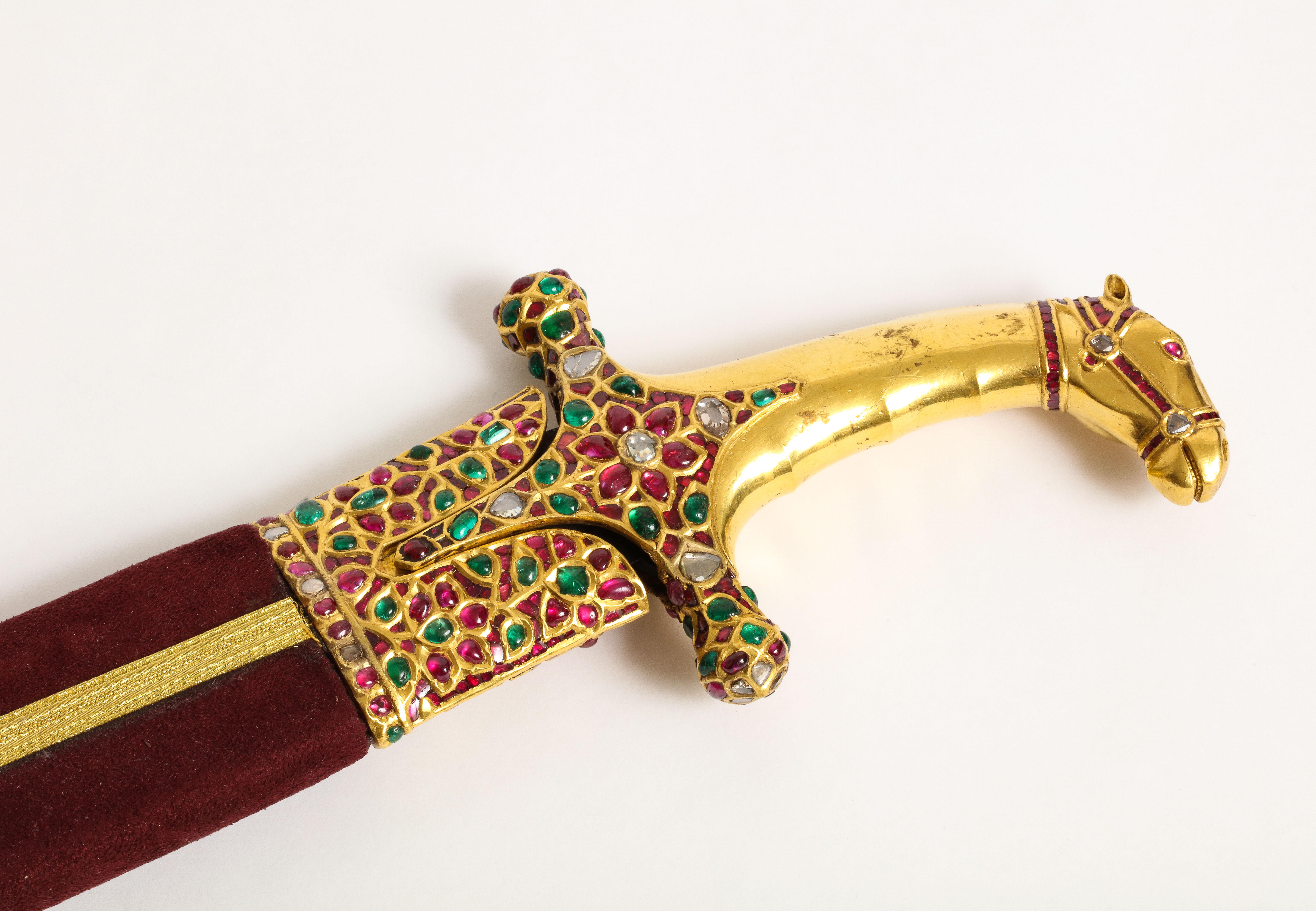 Highly important multi gem Mughal gold horse sword Shamshir

Hilt designed as horse set with diamond, rubies, emeralds set in gold. 

The blade with gold inlay calligraphy 

Made in India 19th century

Length: 39 inches

Provenance: From the
