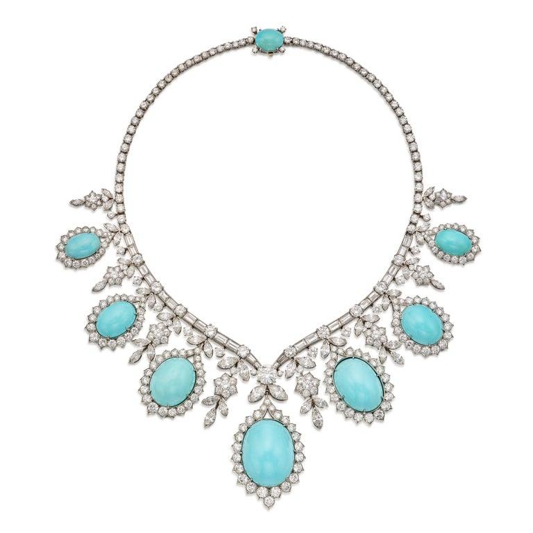 Highly Important Van Cleef and Arpels Turquoise and Diamond Necklace

Of fringe design, suspending seven turquoise cabochons framed by round diamonds and floral motifs set with round and marquise-shaped diamonds, supported by a line of baguette and