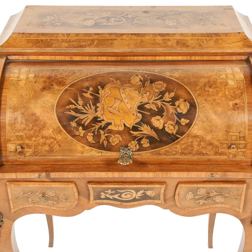 Superior quality on this 19th century highly inlaid and marquetry cylinder desk. Features secret compartments and fabulous ormolu mounts.