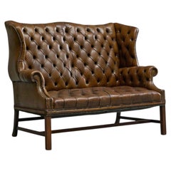 Highly Original Tufted English Wingback Settee in Patinated Leather 1900
