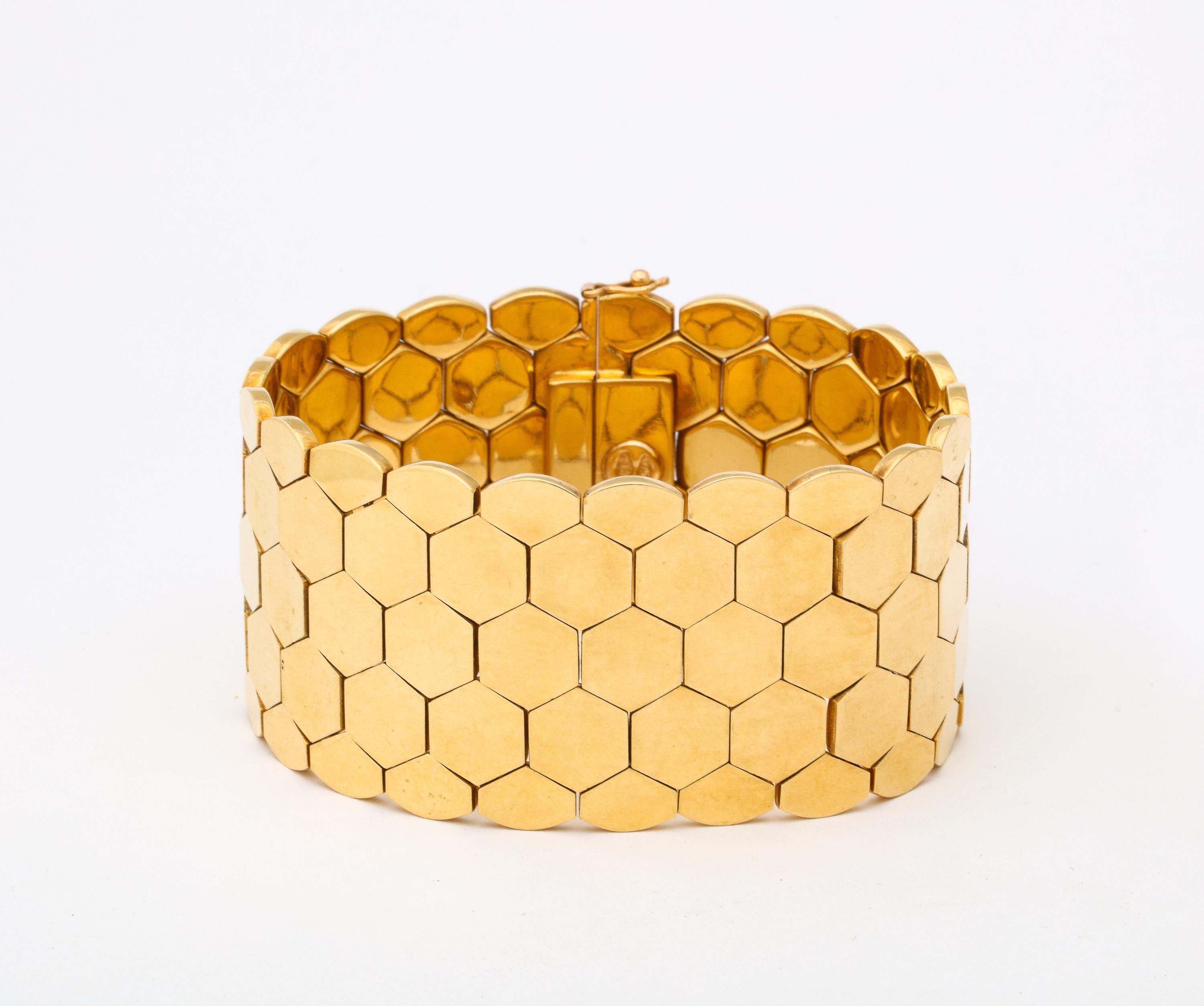 Sleek and ultra chic 18kt RoseGold Honeycomb Bracelet with figure 8 safety..  Bearing Italian control mark AL (Alessandria) and 750 for 18kt.
What a way to keep track of your wrist!  The eye will follow its glistening surface and you know that the