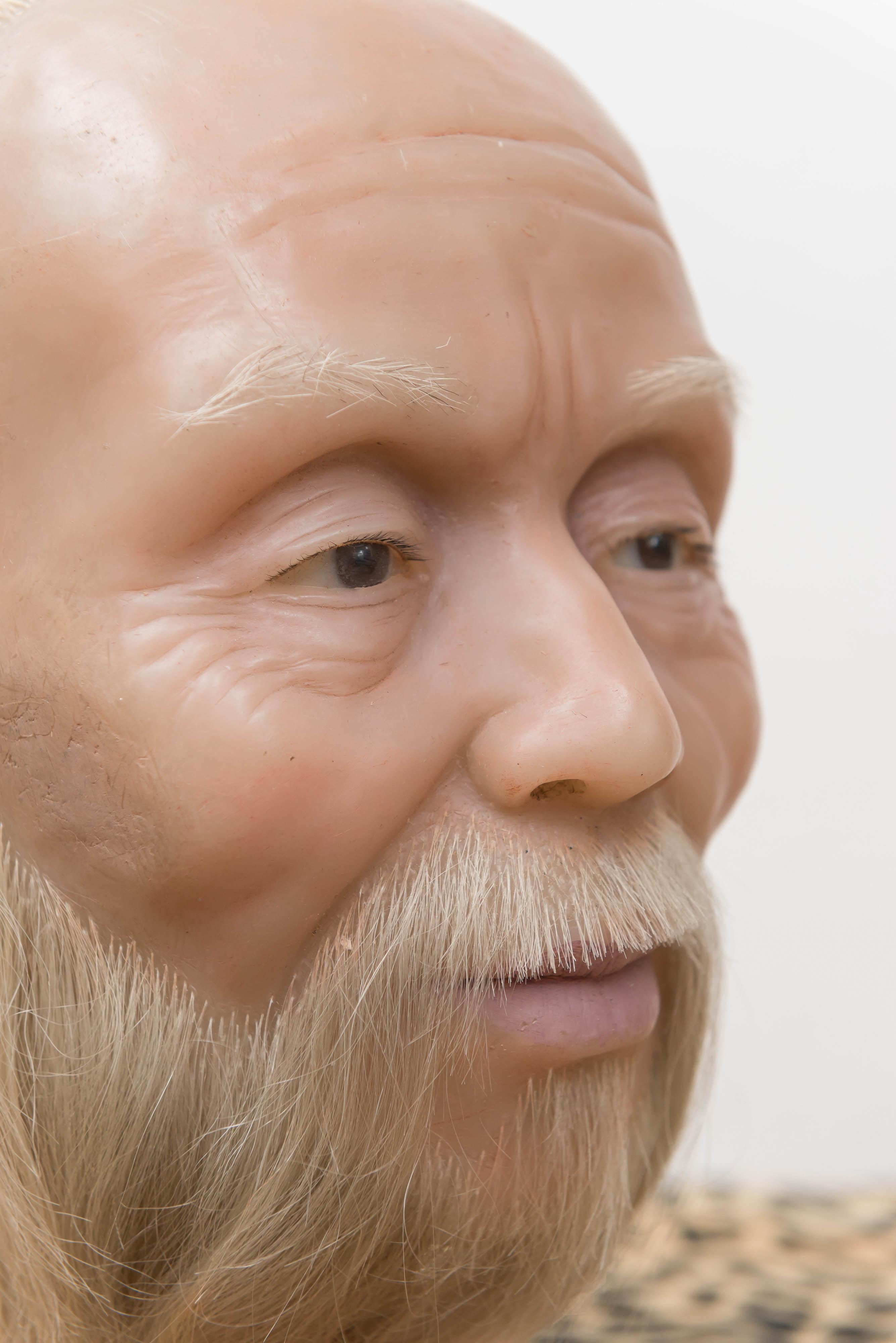 A highly realistic wax head of a Chinese man, mid-20th century. Sits on a simple, flat wooden base.
From the Old San Francisco Chinatown Wax Museum, circa 1960. This museum was designed as a legacy to Chinese culture and Chinese in San