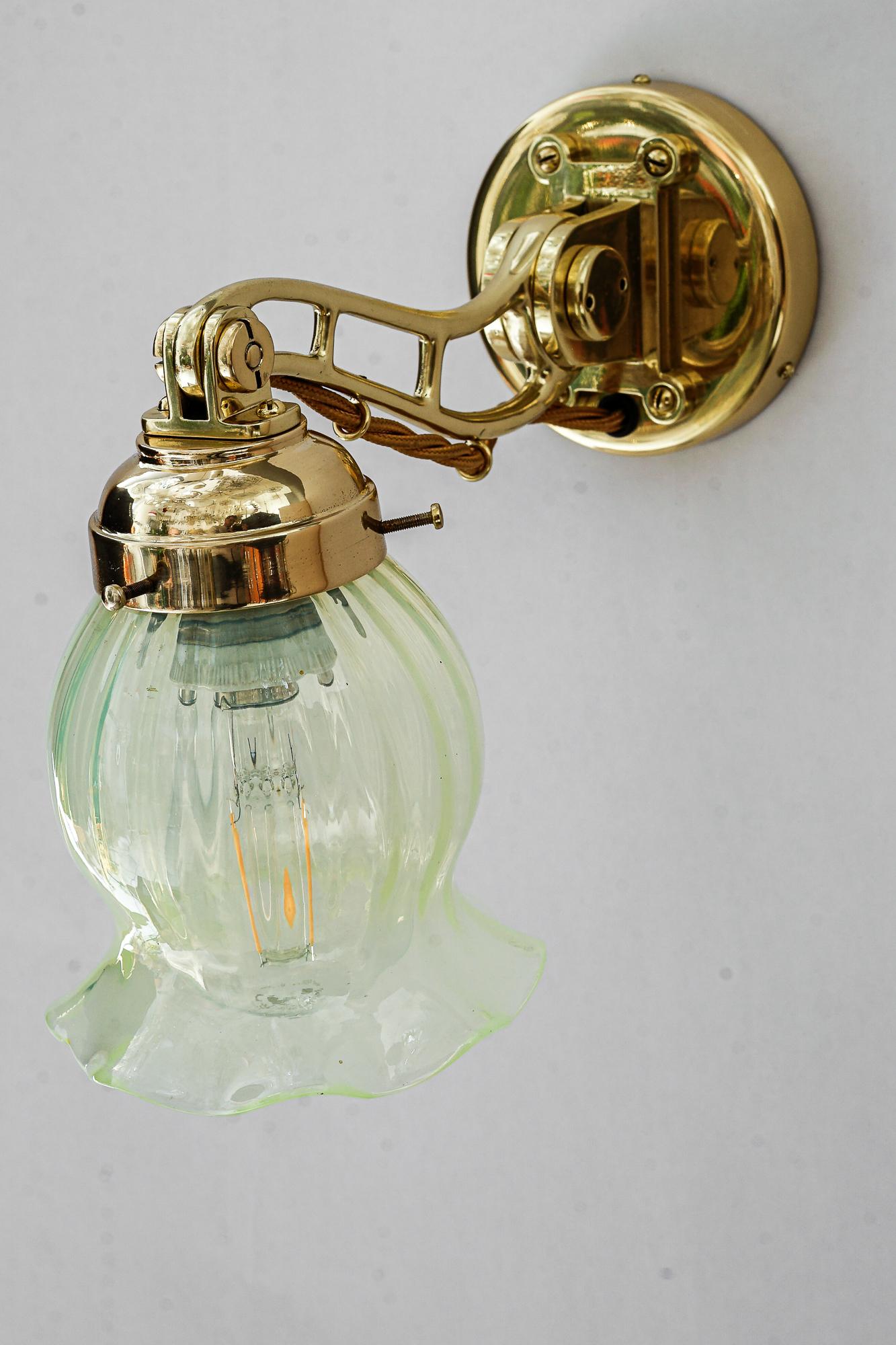 Austrian Hight Quality and solid adjustable wall lamp with opaline glass shade 1920s For Sale