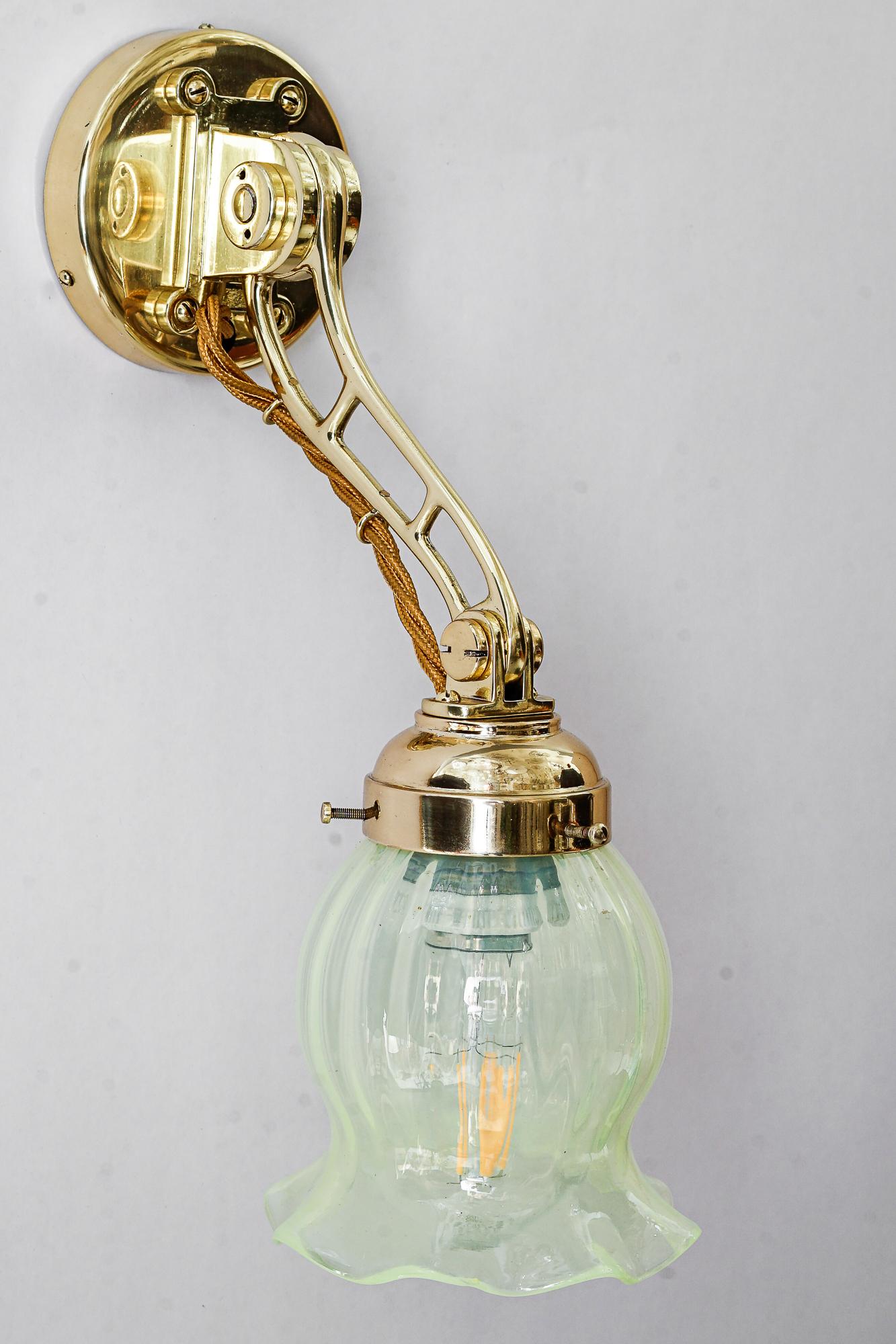 Brass Hight Quality and solid adjustable wall lamp with opaline glass shade 1920s For Sale