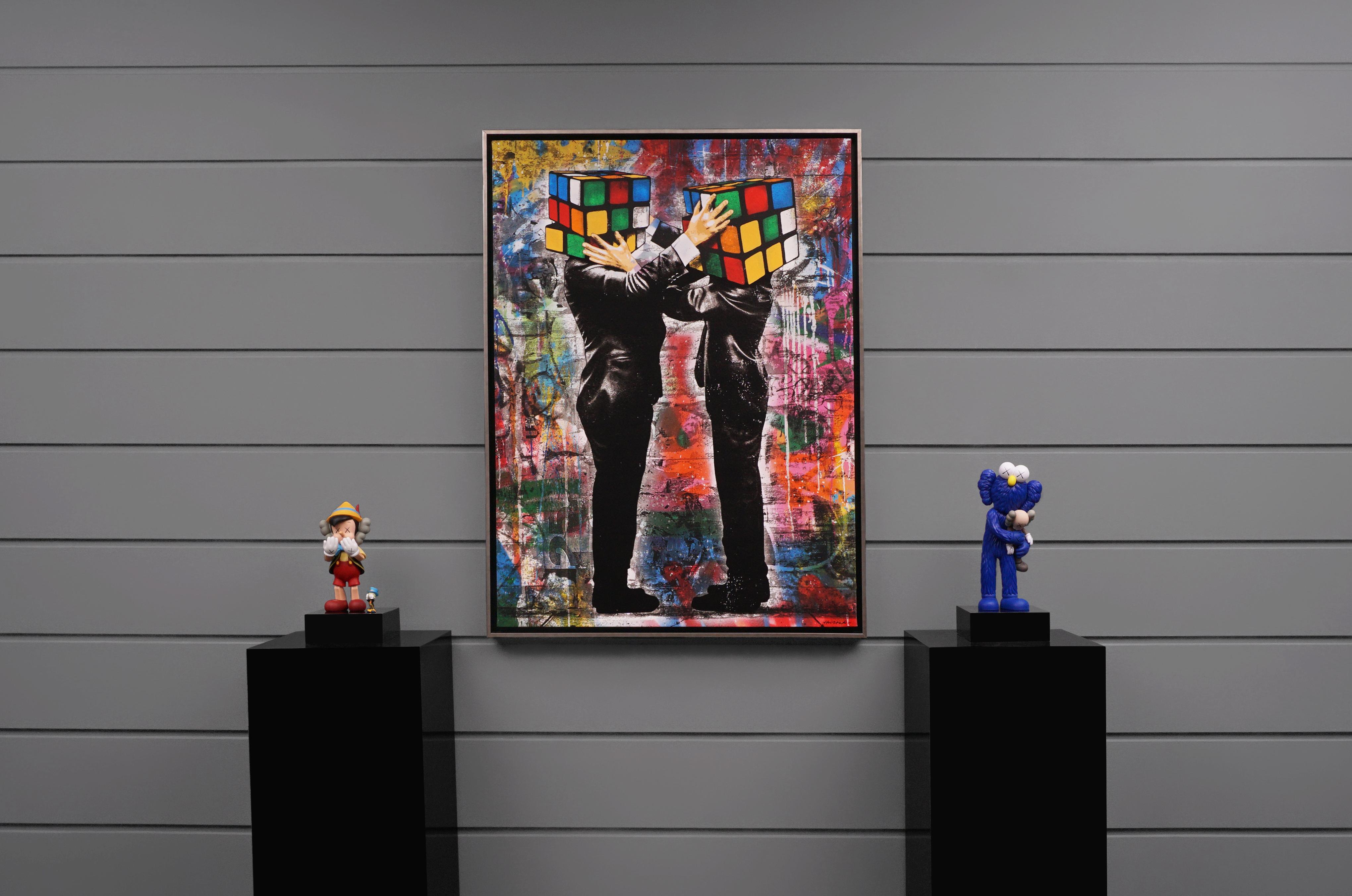 The street pop artwork ‘Puzzled III' on canvas with stenciled graffiti by contemporary street-artist prodigy Hijack, reflects the political and cultural divide in today’s society.  The mulit-color silkscreen, acrylic, and mixed media pop art
