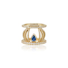 Hikari Ring in 18 Karat Yellow Gold with Diamonds And A Sapphire