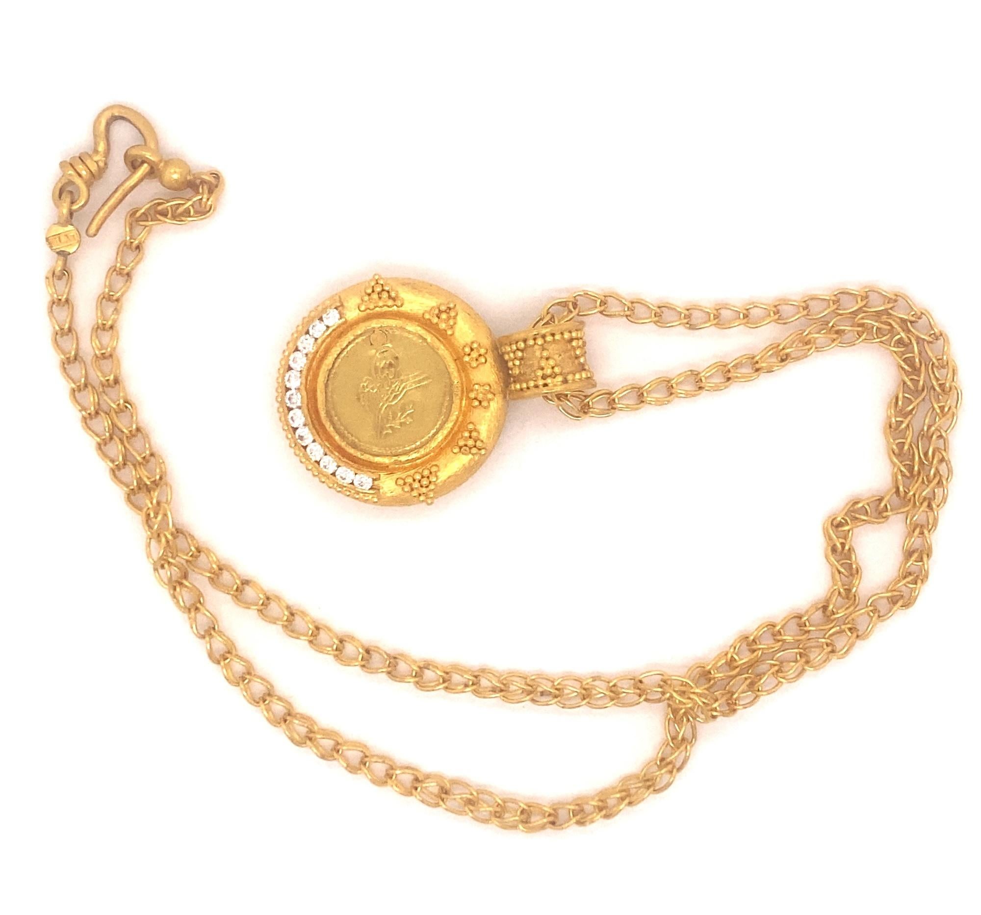 This is a beautiful necklace by Turkish designer Hilat.  The necklace is designed with granulated gold, 12 round diamonds .48 carats H Color VS-2 clarity. The pendant has Turkish gold coin in the center. Pendant and chain signed Hilat, weight 36.8