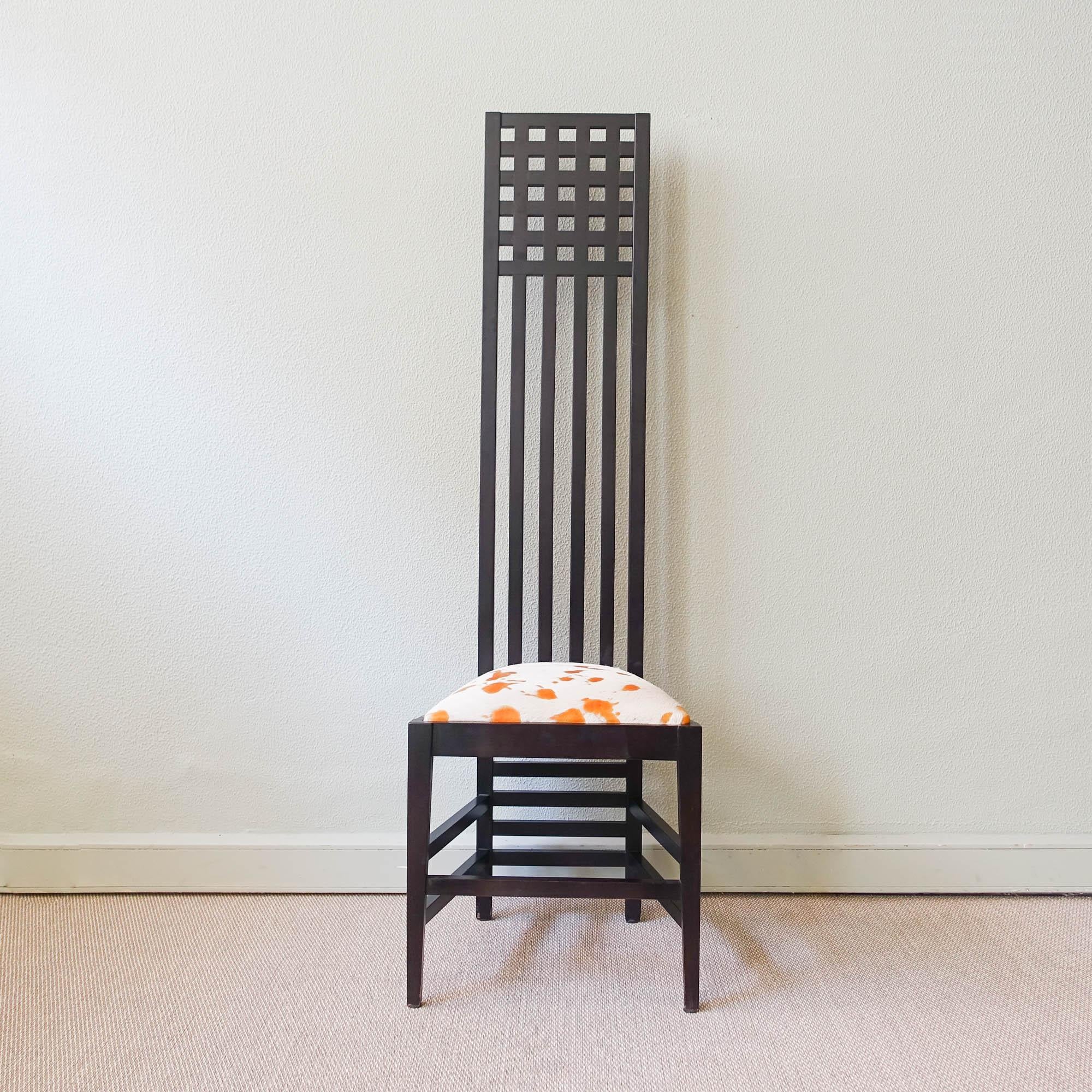 This chair was made in the style of the Hill House Chair, designed by Charles Rennie Mackintosh for Cassina, during the 1980's. Originally a furnishing accessory for one of Mackintosh’s major design projects, Hill House in Helensburgh, near Glasgow,