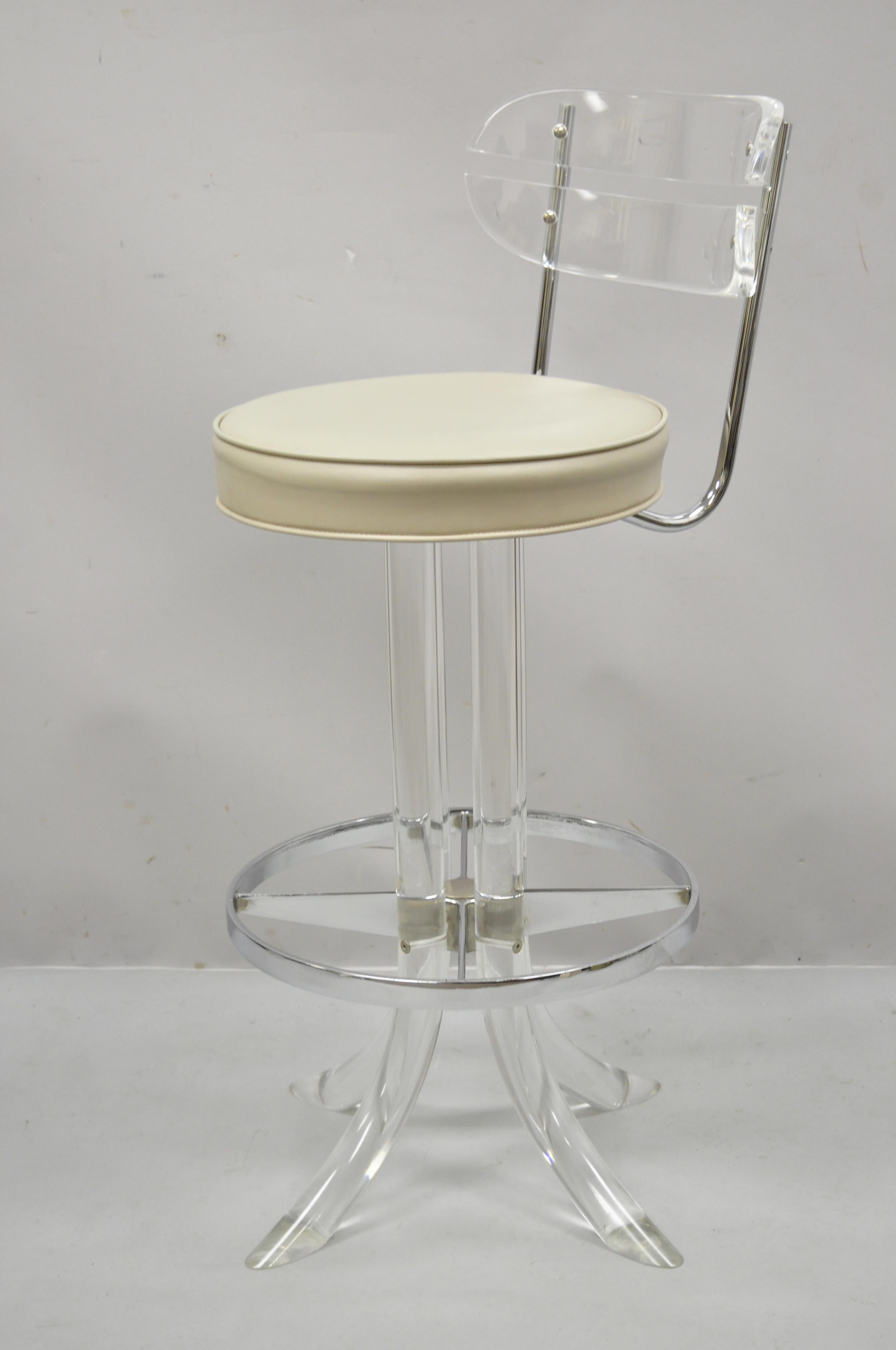 Vintage Hill Manufacturing Corp. Lucite swivel seat tusk faux bamboo barstools after Charles Hollis Jones - Set of 3. Item features swivel seat, bent lucite backs, lucite 