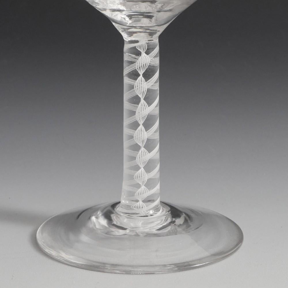 Heading : Hill Ouston reproduction Jacobite engraved wine glass
Period : George V - c1935
Origin : Stourbridge, England
Colour : Clear
Bowl : Ogee - engraved with a rose with two open buds
Stem : A pair of 7-ply bands outwith a double helix
Foot :