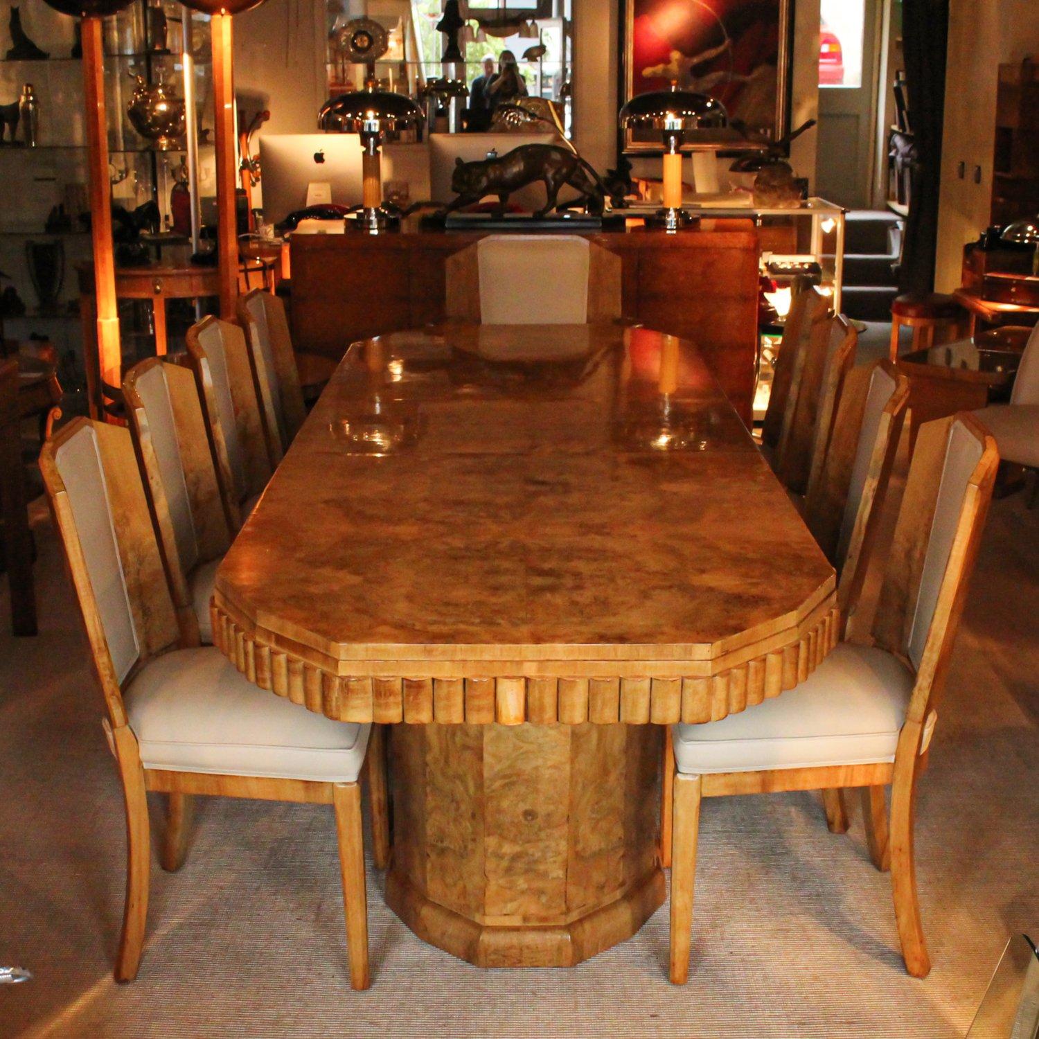Art Deco, walnut veneered dining table with ten chairs (eight chairs and two armchairs) by Hille. Refurbished, re-polished and re-upholstered in cream leather.

Dimensions: H 78 cm L 265 cm, W 95 cm
Armchair seat W 66 cm, seat D 50 cm, seat H 46