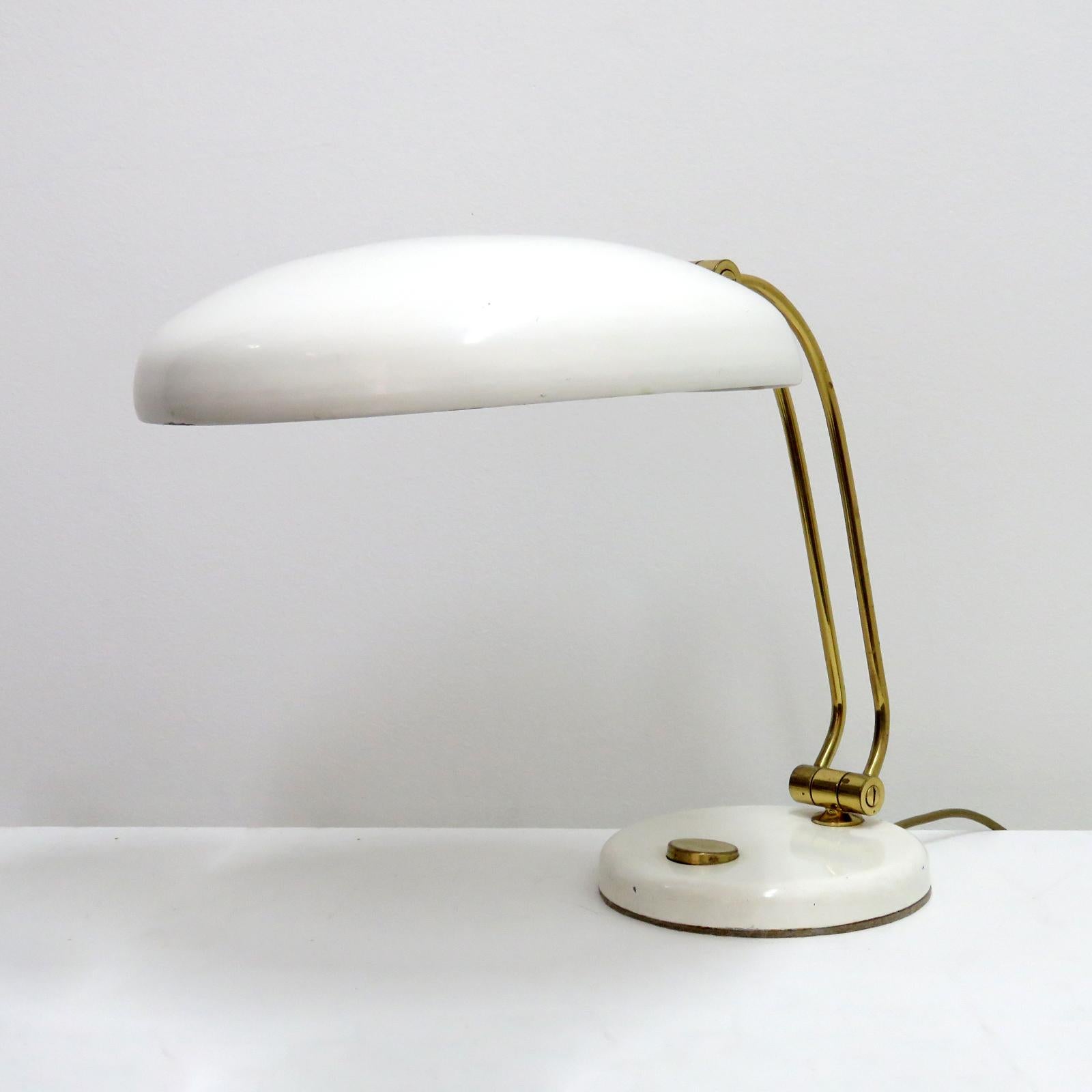 Wonderful table lamp by Hillebrand, 1960, in white and brass, on/off switch at the base, shade and arm are adjustable, wired for the US standards, one E26 socket, max. wattage 75w or LED equivalent, bulb provided as a onetime courtesy.