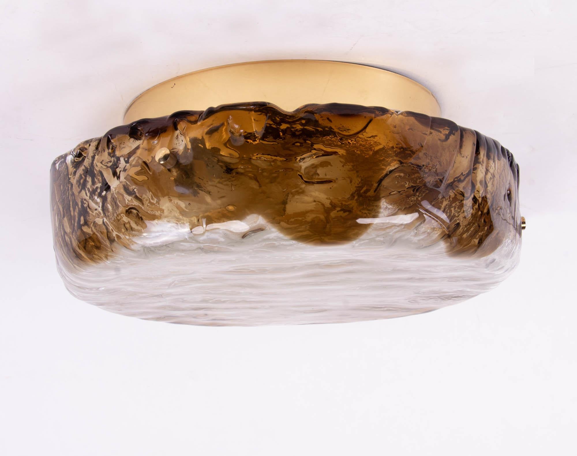 Elegant ceiling light executed in amber and clear Murano glass on a brass frame. Manufactured by Hillebrand, Germany in the 1960s. 

Materials: Murano glass and brass. 
Colors: amber, clear and golden. 
Measures: diameter 13.4