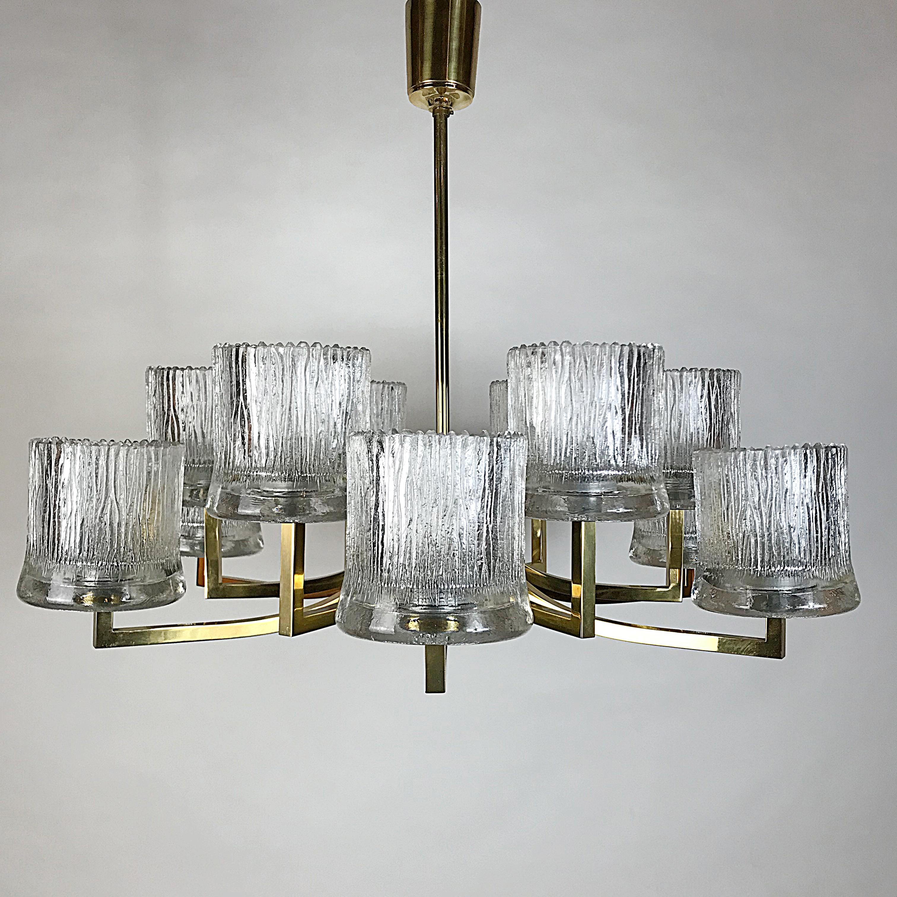 Huge beautiful Mid-Century Modern chandelier manufactured by Hillebrand, with the characteristic blown ice glass cups and brass frame. This chandelier is a striking appearance in every room. Due to the sublime combination of glass and chrome, this