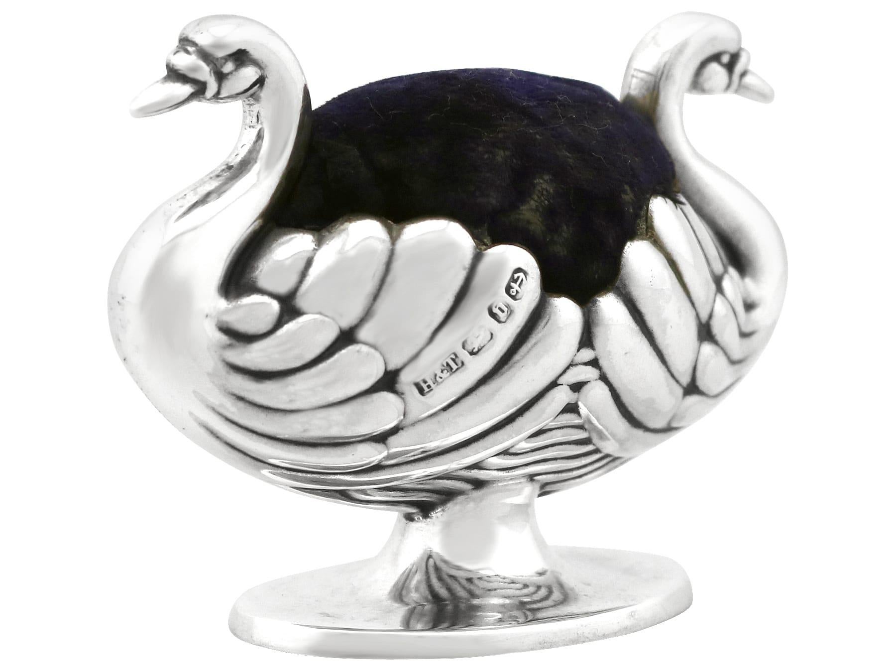 A fine and impressive antique Victorian sterling silver pin cushion modelled in the form of two swans; an addition to our animal related silverware collection.

This fine antique Victorian sterling silver pin cushion has been realistically