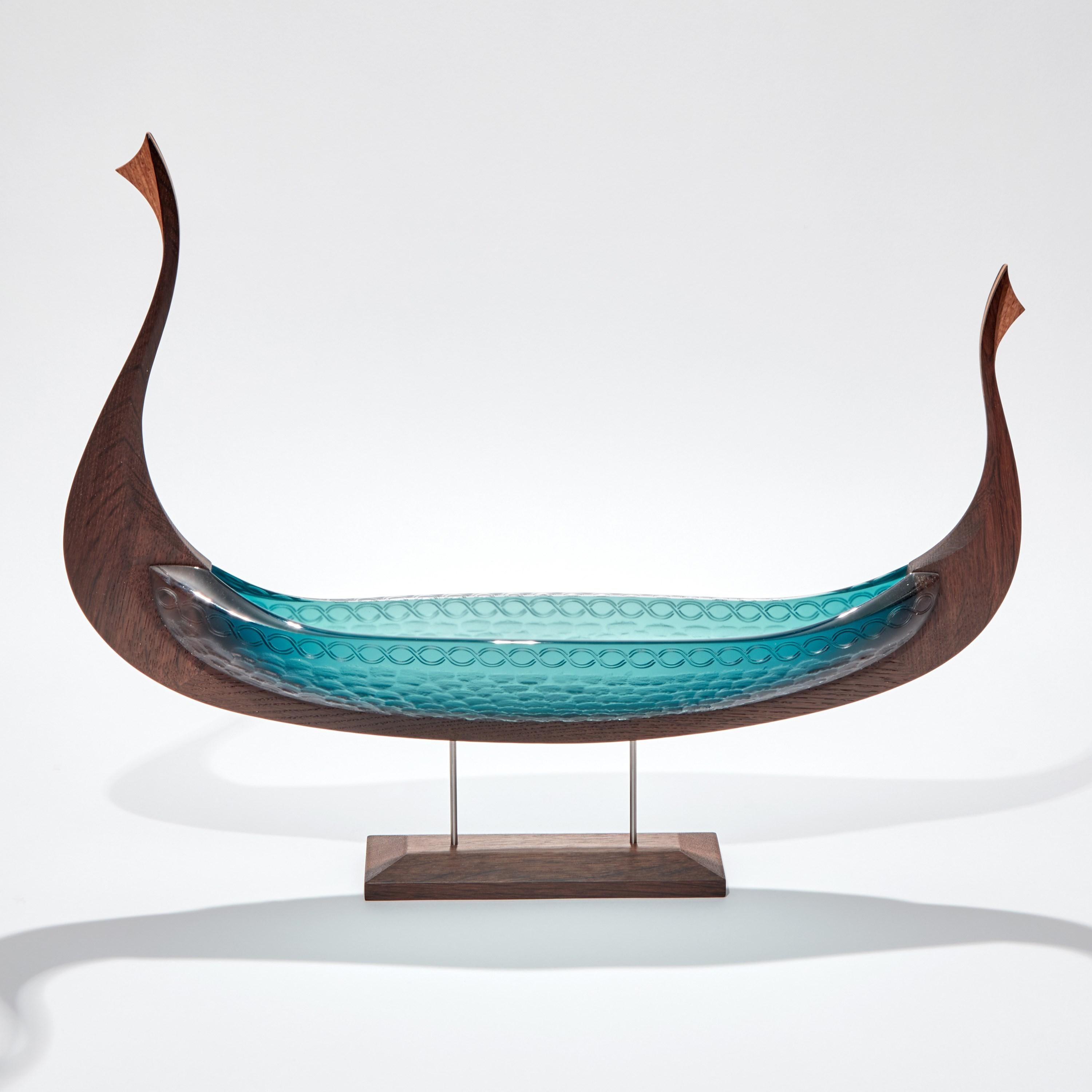 Fine cabinet making & crafted oak with handblown & cut teal aqua glass combine to create this unique sculpture 