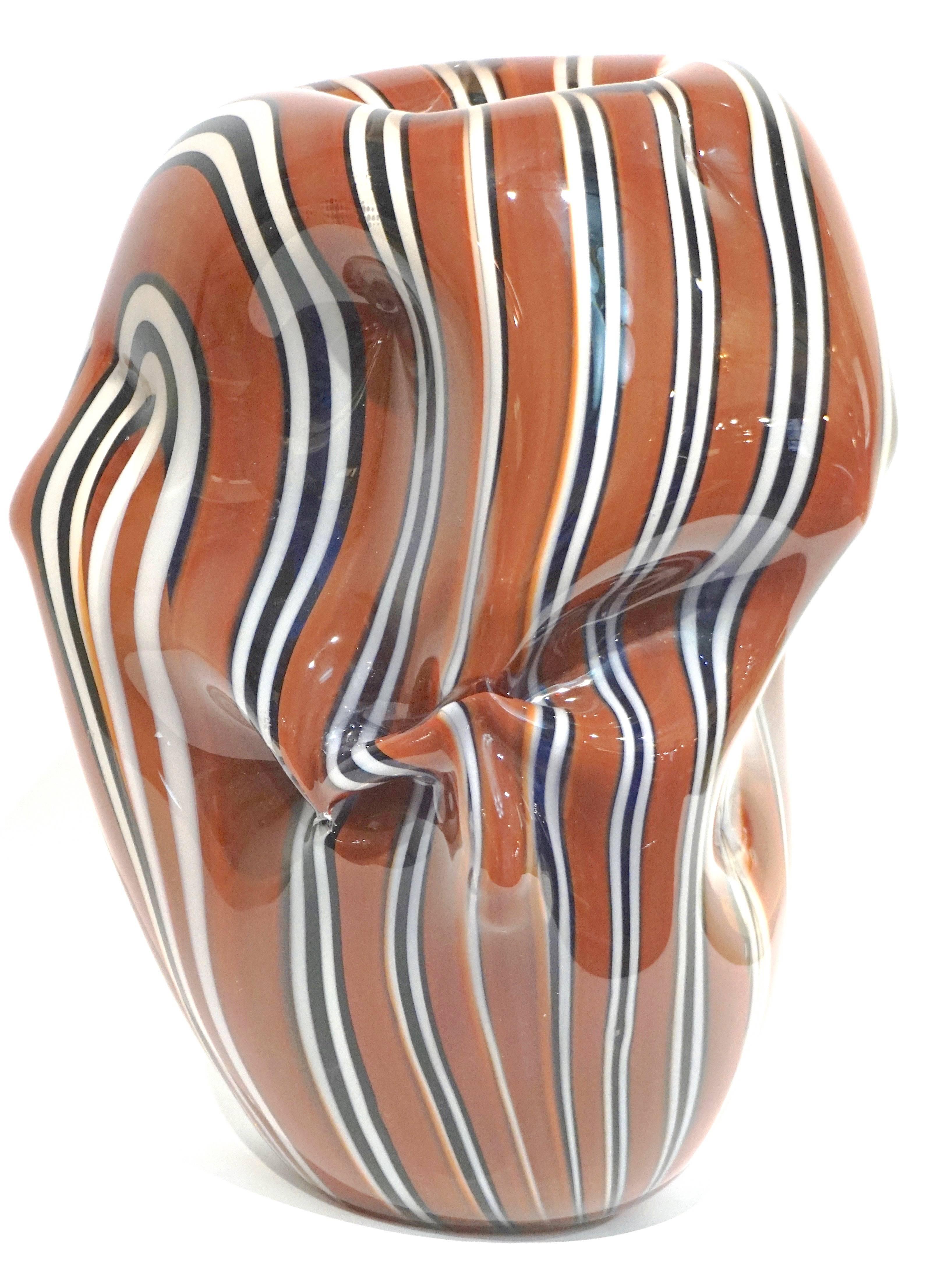 One-of-a-kind organic modern glass sculpture signed by Hilton McConnico for Formia, Murano, designed and blown in the 1990s. The overlaid glass has been worked in an innovative sensual scrunch shape that looks like crumpled fabric, this similarity