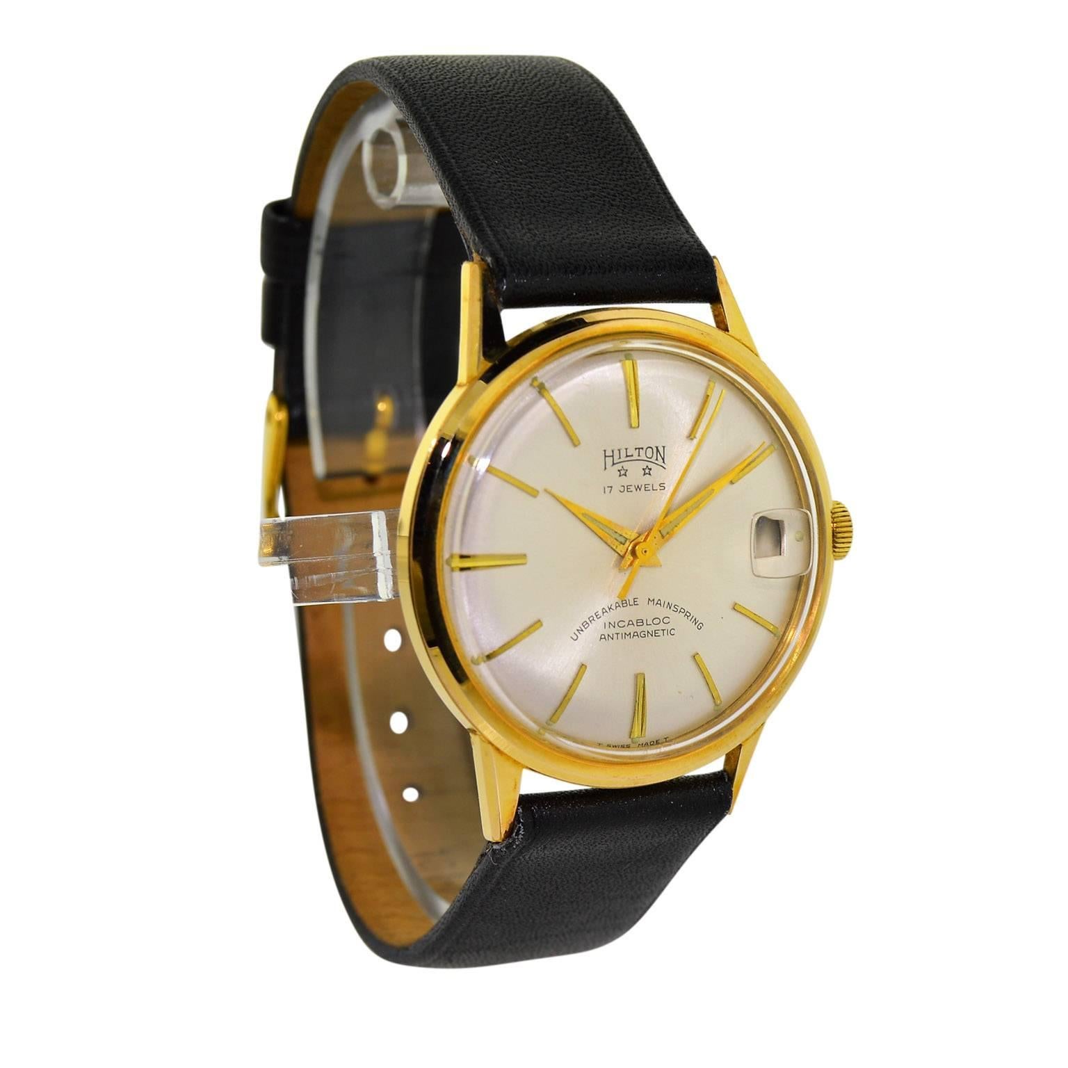 FACTORY / HOUSE: Hilton by Enzo Watch Company
STYLE / REFERENCE: Moderne / Round
METAL / MATERIAL: Yellow Gold Filled
CIRCA: 1950 / 60's
DIMENSIONS: 41mm X 34mm
MOVEMENT / CALIBER: Manual Winding / 17 Jewels / Cal. Font 72-4n 
DIAL / HANDS: Original