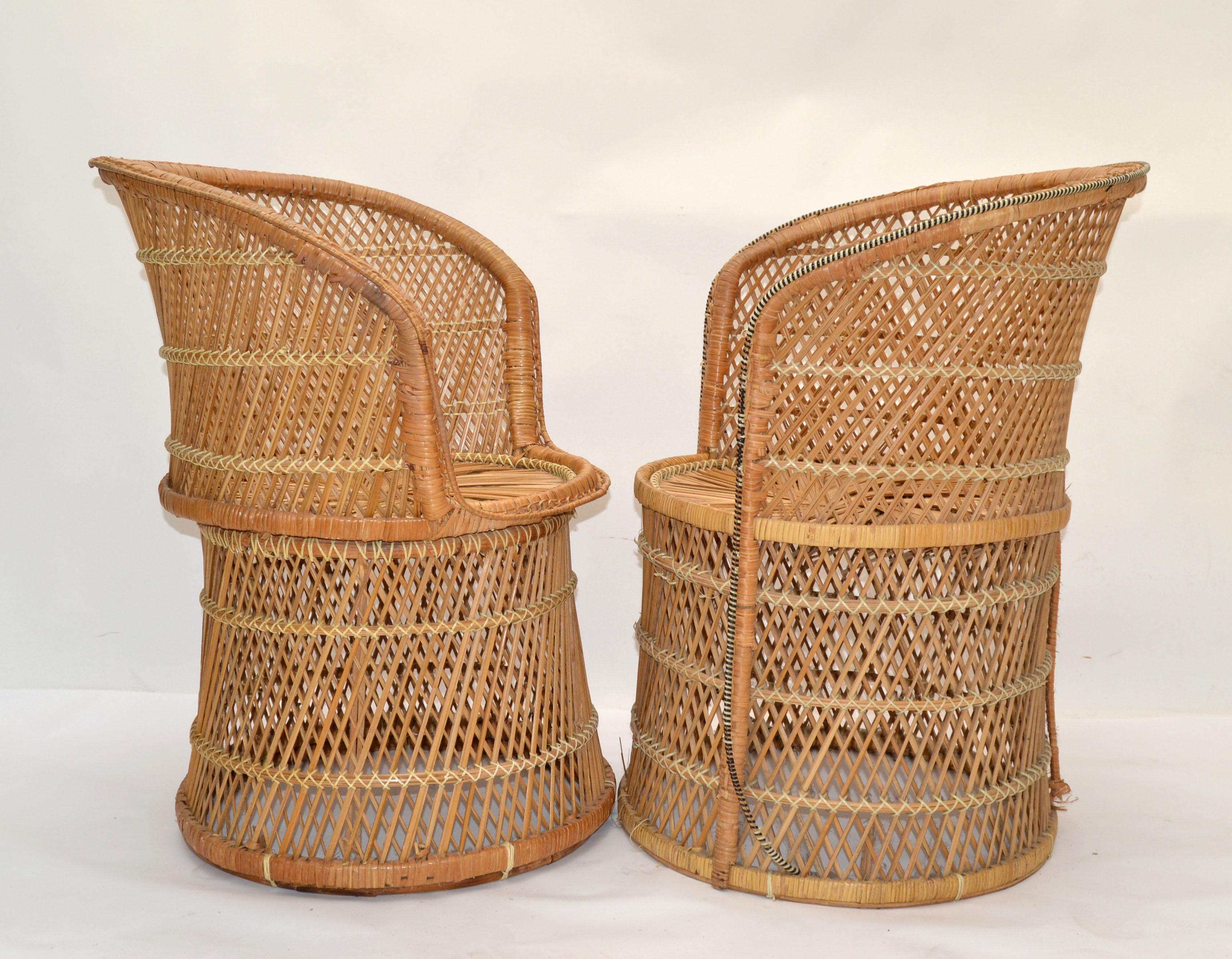 Vintage Set of Him & Her Cane, Bamboo and Wicker armchairs. These are handcrafted chairs with cane seats feature bamboo frames and Chinese inspired bamboo patterns. The backrests are designed with an extraordinary pattern as shown in the pictures.
