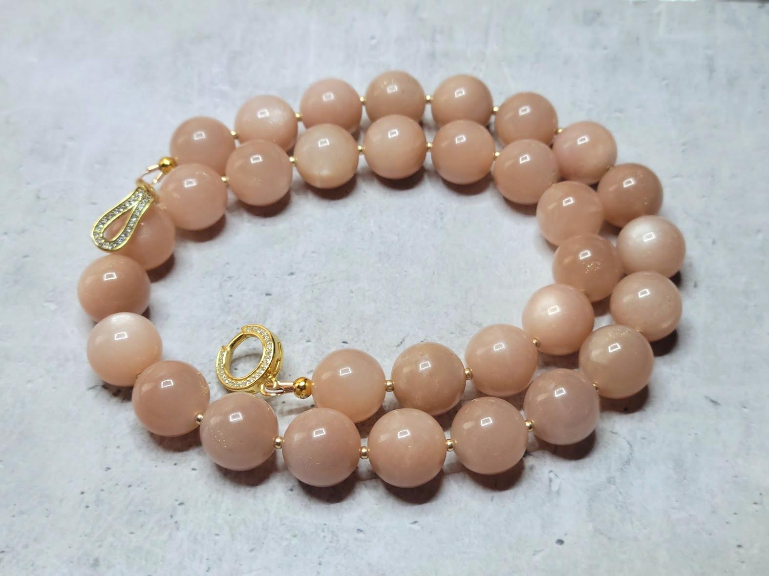 The length of the necklace is 18 inches (45.7 cm). The size of the smooth round beads is 12 mm. The moonstone beads are high-quality AAA. Peach Moonstone is mined in the Himalayas.
Beads have a delightfully soft, gentle, uniform peach tone with an