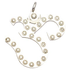 Hindu symbol pendant in gold and diamonds