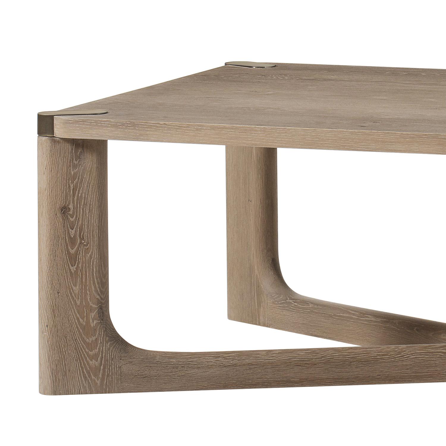 Coffee table Hines with all structure in natural light
oak veneered finish, with brass satinated corners on the top.