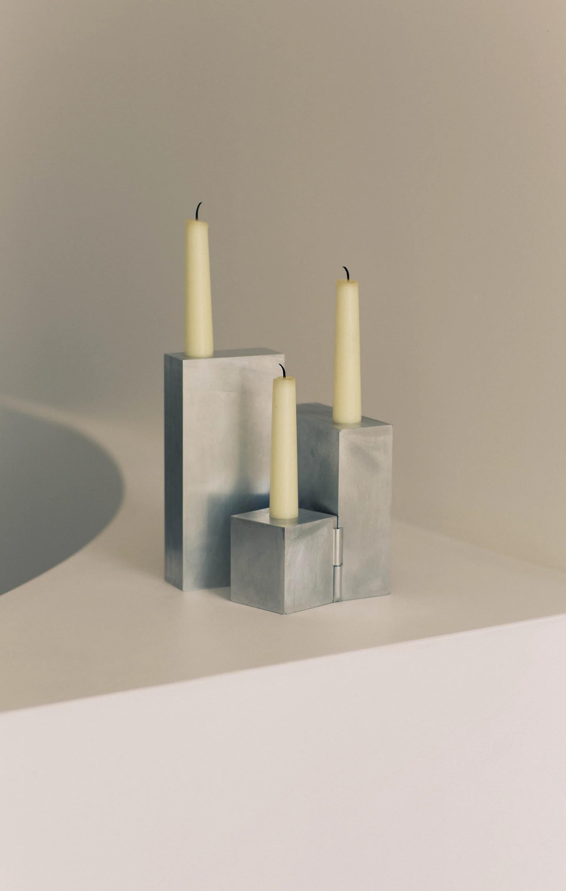 Hinge Aluminum Candelabra by Henry Wilson
Dimensions: D 22 x H 19 cm
Materials: Brushed aluminum.

Available in sterling silver plated or aluminum.

Intended as the playful expression of a love for the technical side of design, this abstractly