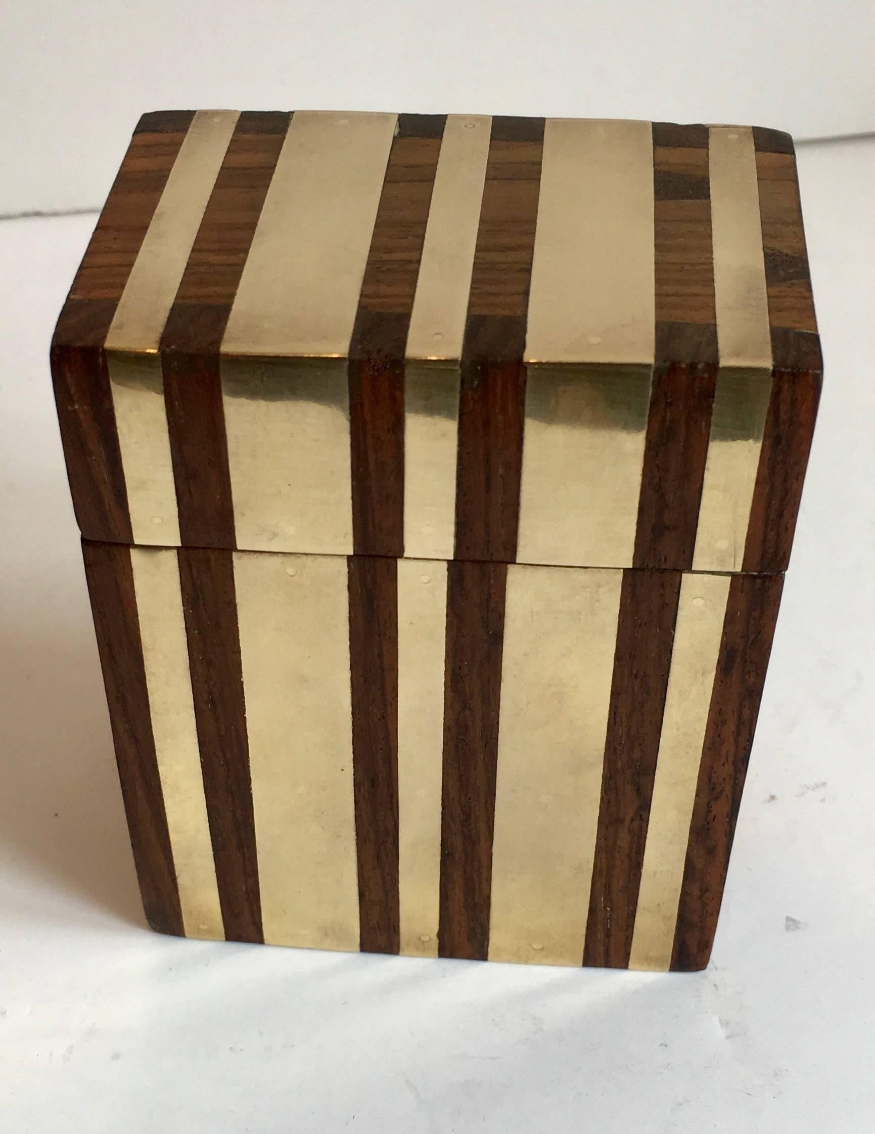 Hinged wooden box with inlaid brass strips - a unique storage piece, handsome in any setting.