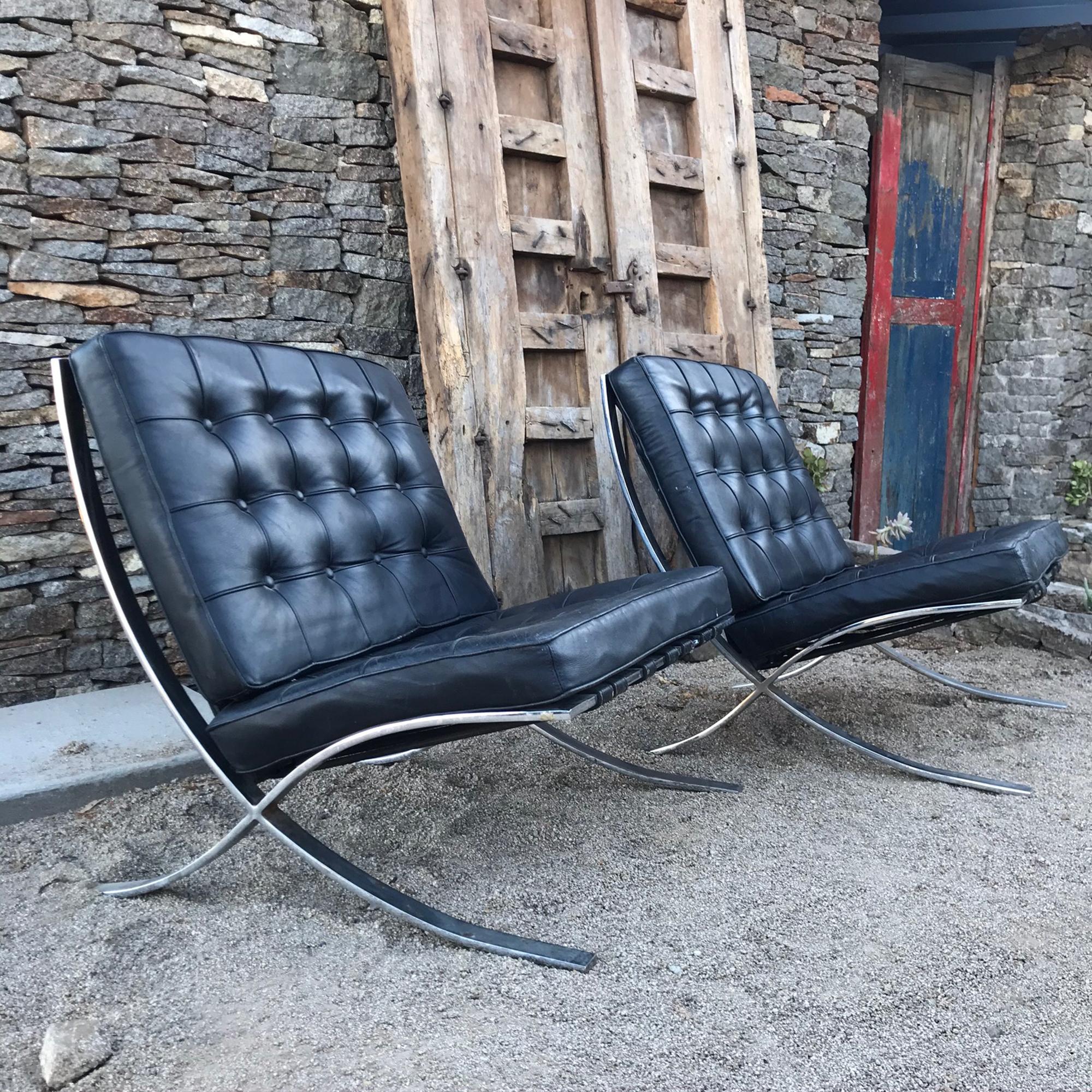 A pair of iconic black leather vintage Barcelona chairs with chrome-plated steel frame designed by Ludwig Mies van der Rohe, 1970s.
Epitome of class and style. The hippest statement ever!
No label present from the maker.
Expect vintage wear. Chrome