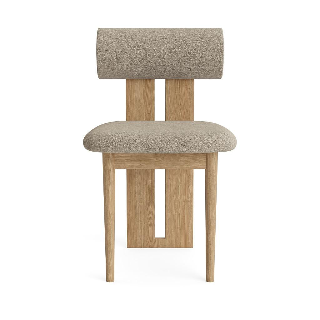 Hippo chair.
Signed by Kristian Sofus Hansen and Tommy Hyldahl for Norr11. 

Model shown on the picture:
Wood: Natural oak
Fabric: Barnum Bouclé 03

Wood types available: natural oak / light smoked oak / dark smoked oak / black oak.
Fabric: