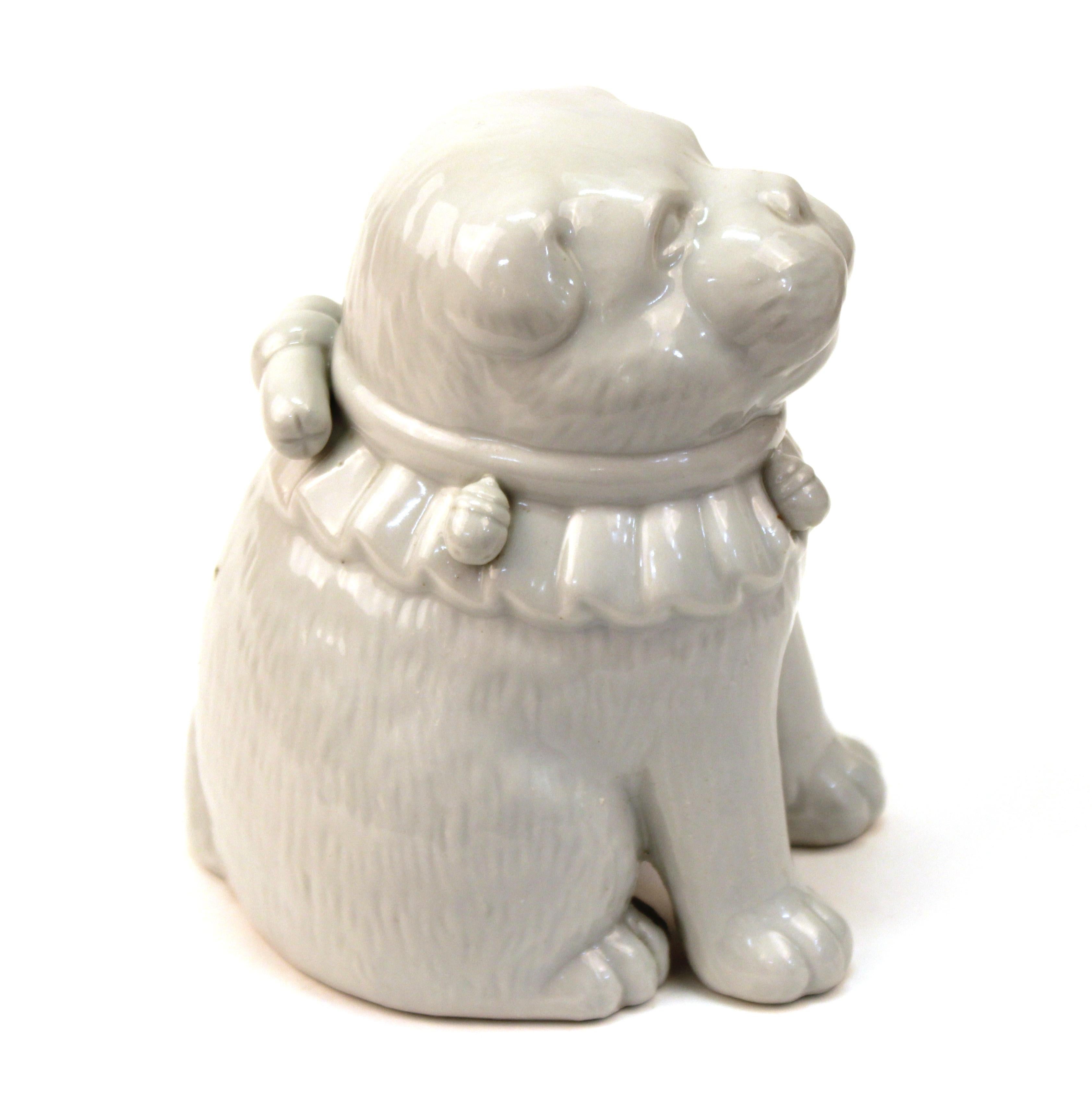 Japanese Meiji period glazed porcelain figure of a puppy dog, made by Hirado Porcelain. The puppy is wearing a collar with bells. Likely made in circa 1890. In great antique condition with age-appropriate wear and use.