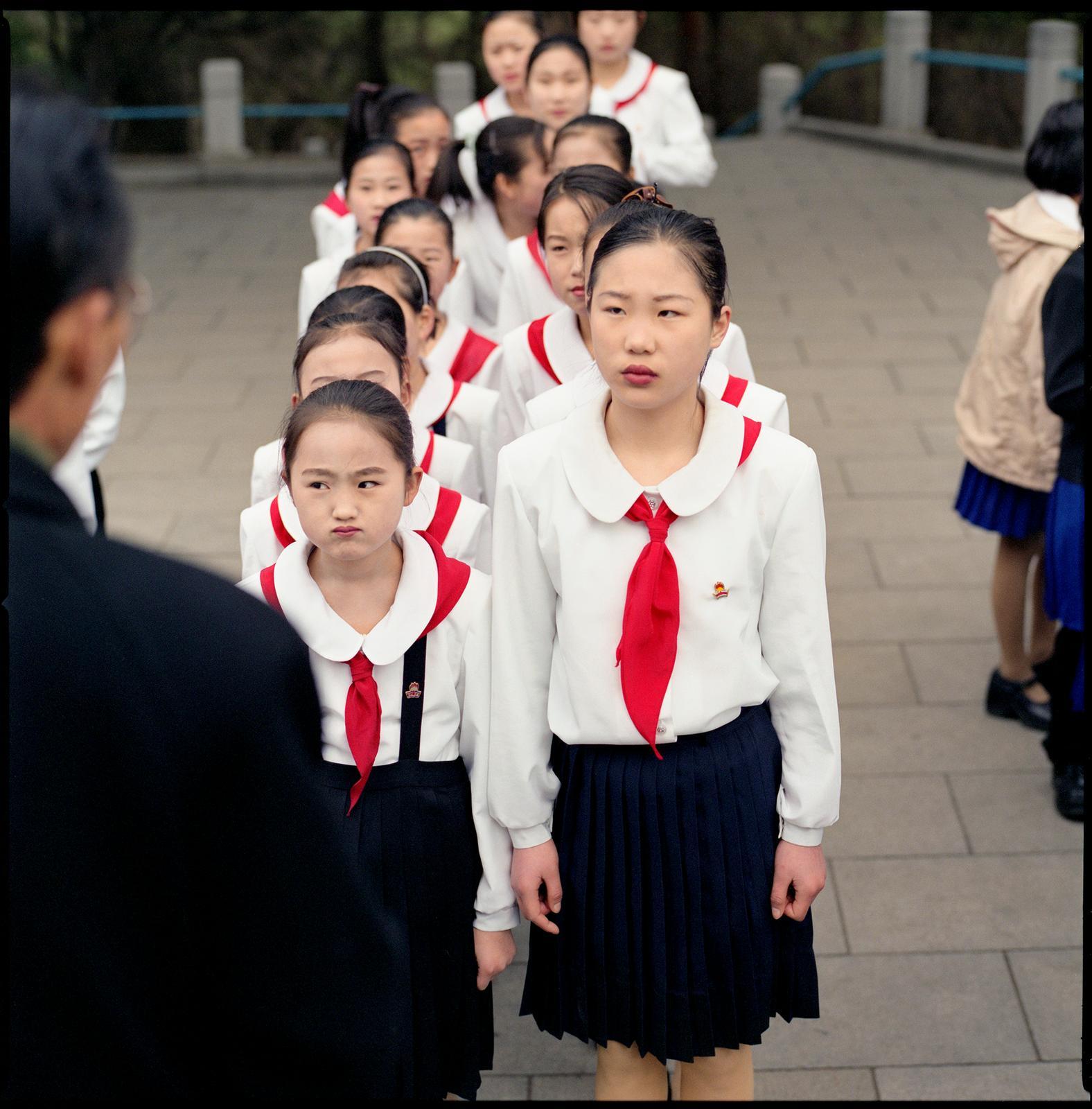 Hiroshi Watanabe Color Photograph - Students and Their Teacher, Mangyongdae, North Korea
