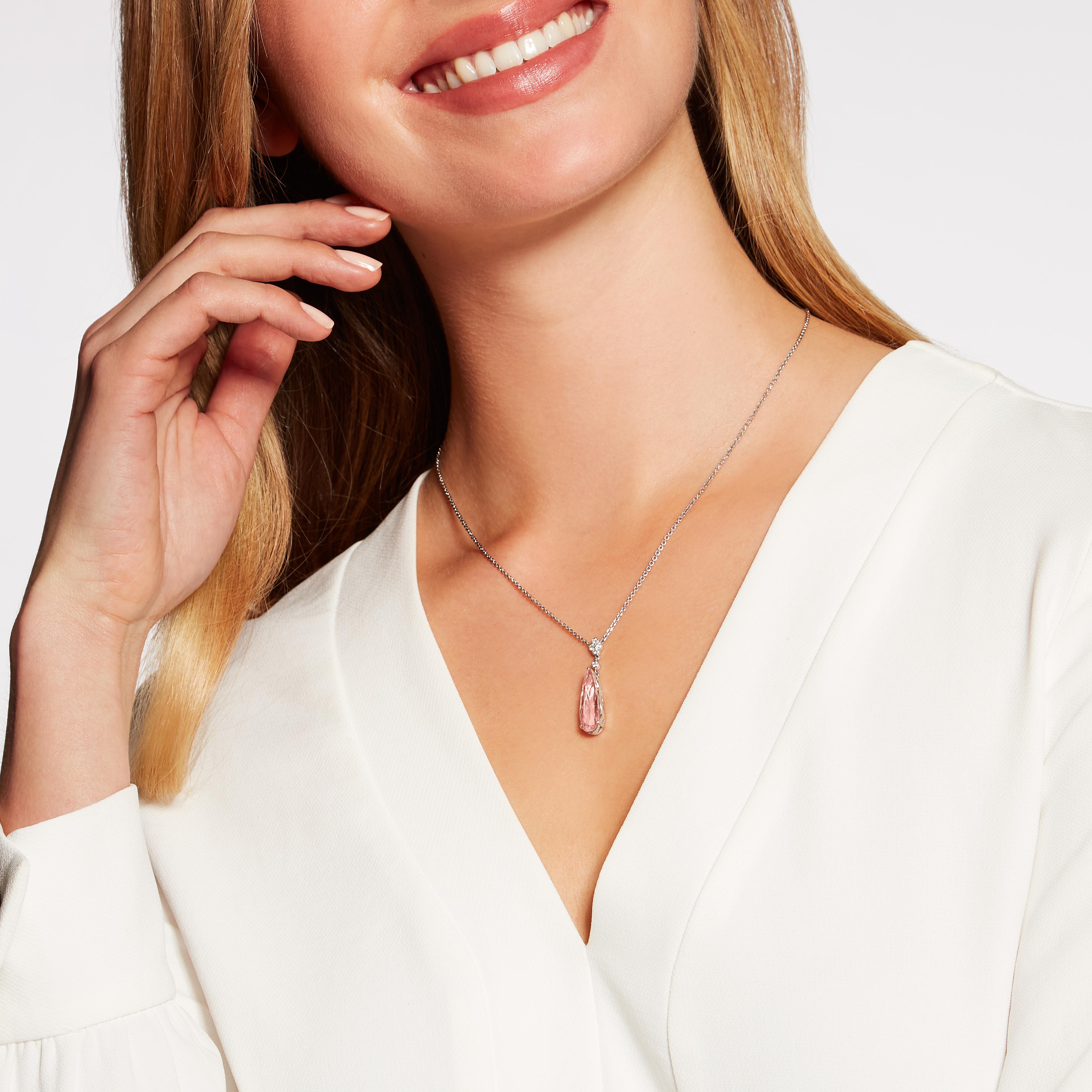 A stunning 4.93 carat pear shape Kunzite set below a diamond top in the Hirsh Chatsworth setting. This beautiful pendant is handmade in London in platinum with a total diamond weight of 0.12 carats. 

Formed deep within the earth and found on every