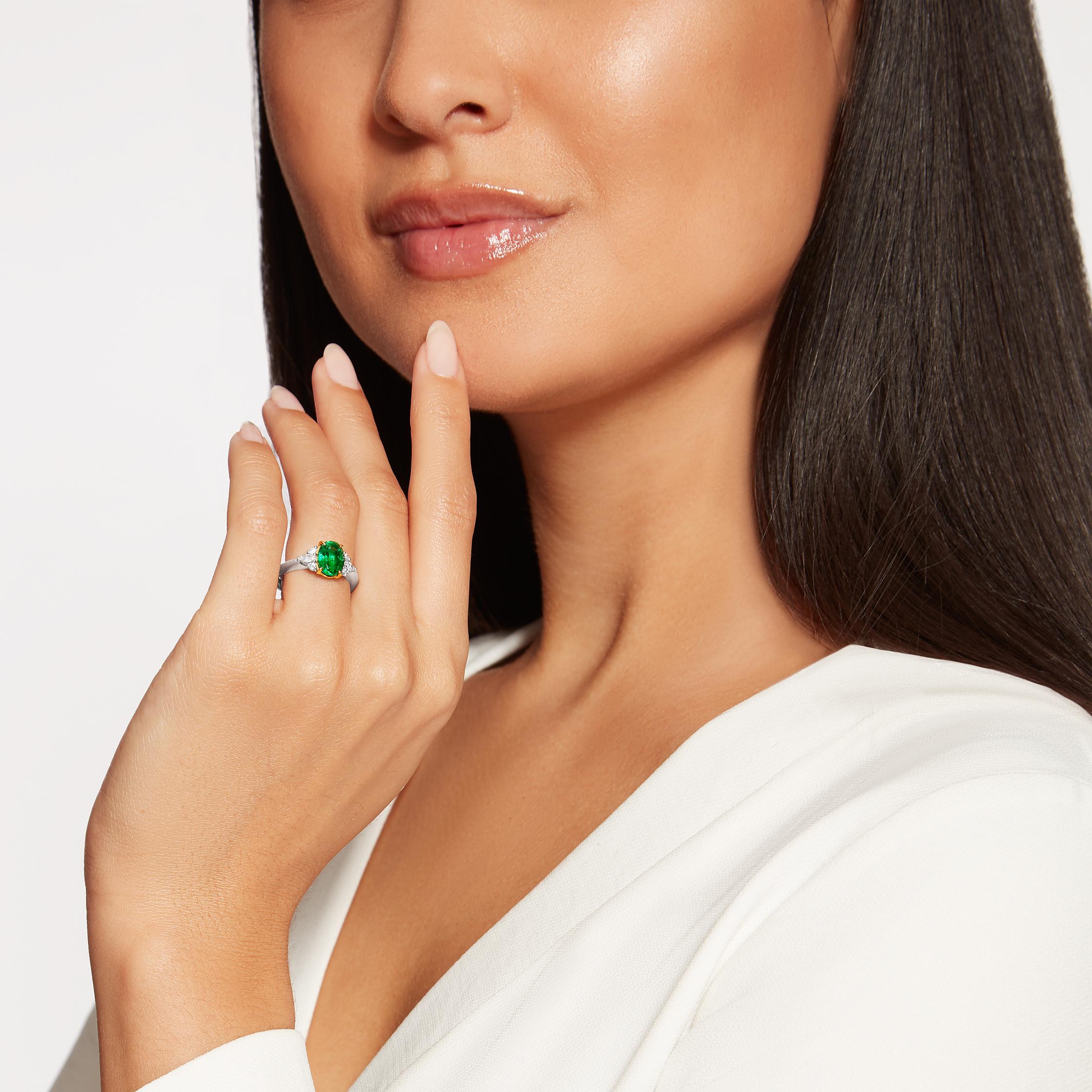 This beautiful papillon ring features an oval emerald that is uniquely set with 18K yellow gold claws in a platinum setting featuring marquise and round diamonds.

- 1.55 carat oval emerald
- 2 marquise and 4 round diamonds totalling approx. 0.24