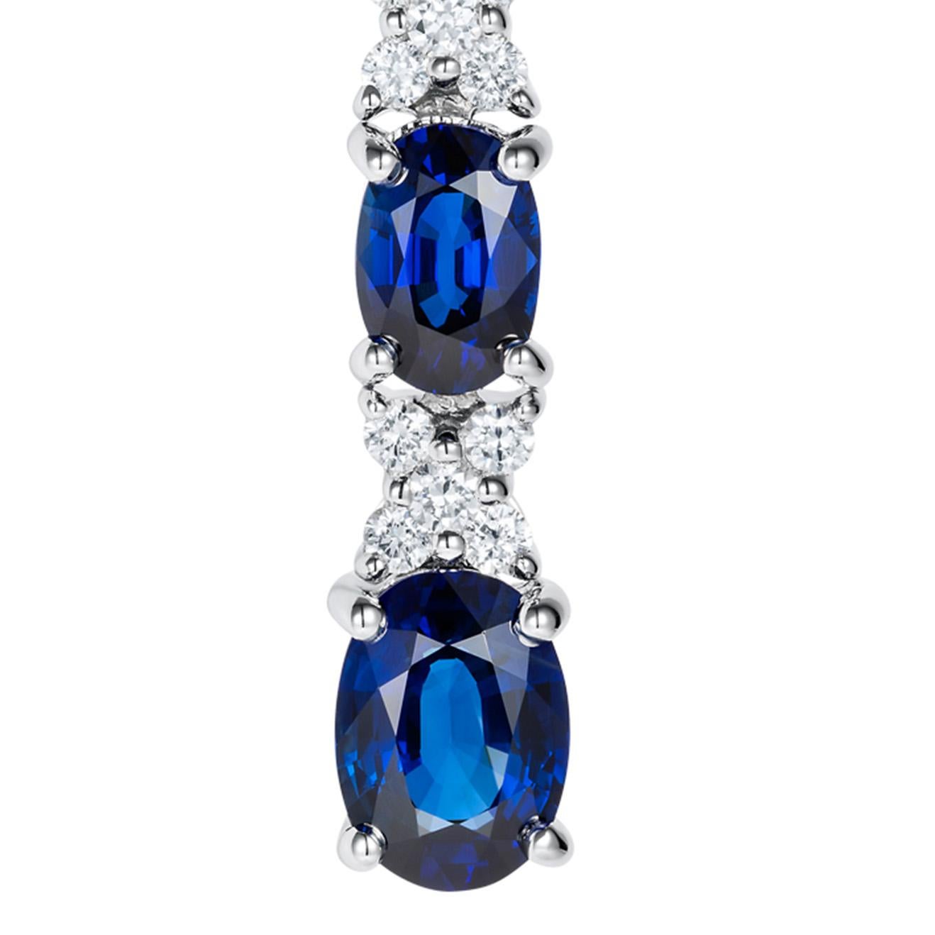 These exquisite sapphire and diamond earrings are an ode to love. Featuring oval royal blue sapphires set with white diamonds which form the X design. Beautifully created in 18K white gold – these stunning drop earrings contain 6 oval blue sapphires