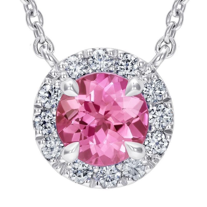 A stunning pink sapphire, weighing 0.55 carats, surrounded by a beautiful halo of diamonds, weighing 0.11 carats, in the Hirsh Regal setting. Created in platinum and entirely handmade in London.

Formed deep within the earth and found on every