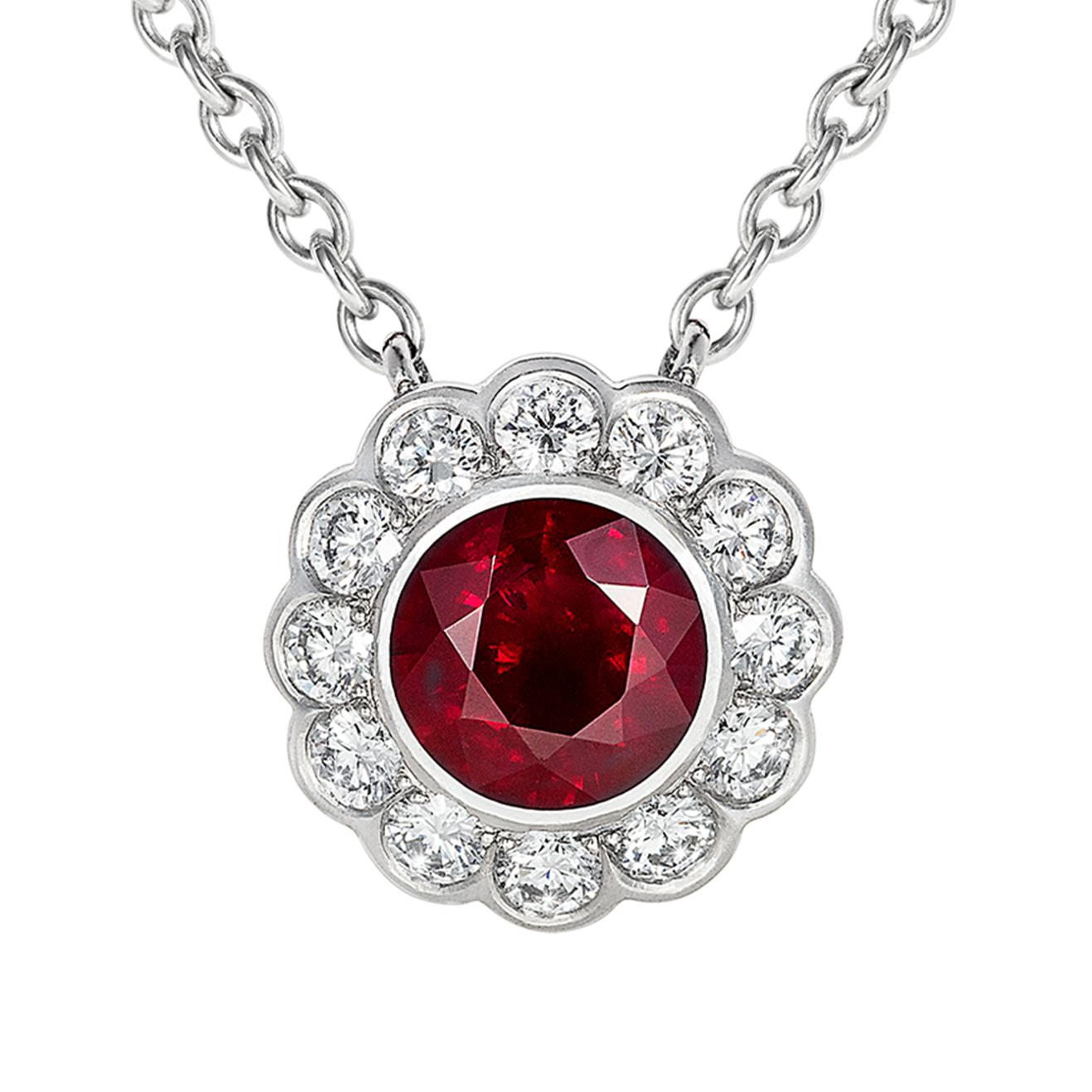 This beautiful ruby and diamond Carnation pendant features a beautiful ruby of perfect colour, weighing approximately 1.04 carats surrounded by a pretty halo of brilliant cut diamonds that weigh approximately 0.37 carats. This beautiful pendant is