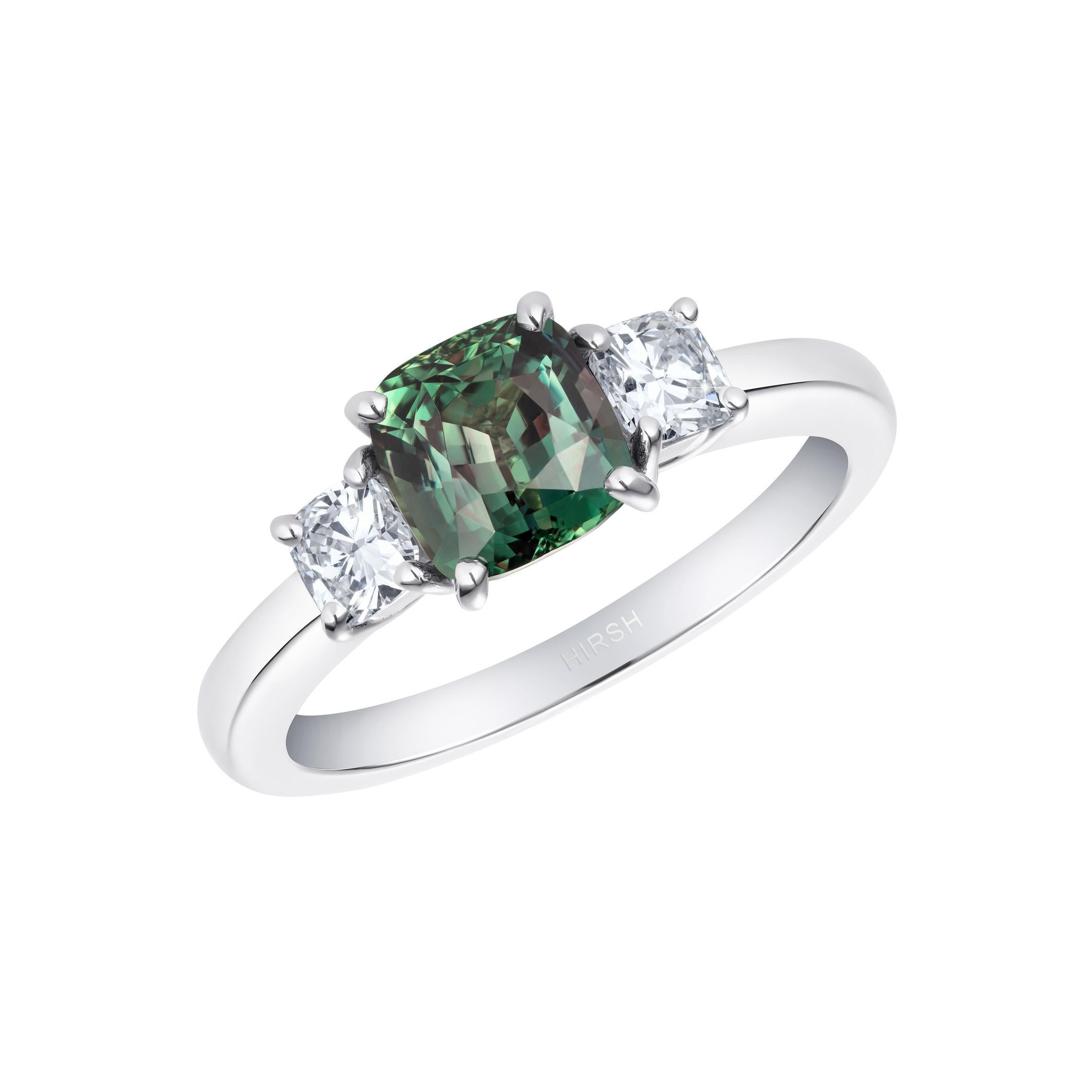 A stunning cushion cut natural colour-change Alexandrite is set in the Hirsh Trilogy setting amongst perfectly matched diamond side stones.

This beautiful gem appears green in daylight and a lovely reddish purple in incandescent light.

- 1.53