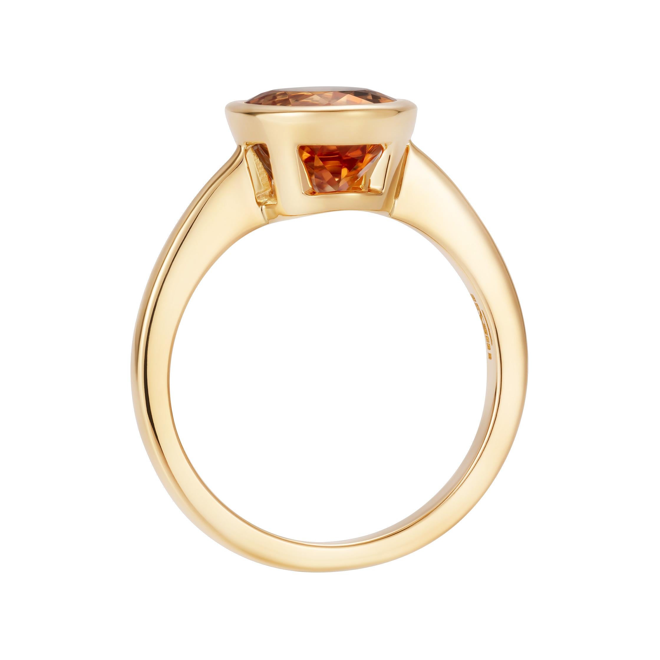 A stunning oval imperial Topaz set in an 18k yellow gold Venus setting.

- 3.89 carat oval golden topaz
- Handmade in 18K yellow gold in our Mayfair atelier

Formed deep within the earth and found on every continent, natural colour gemstones possess