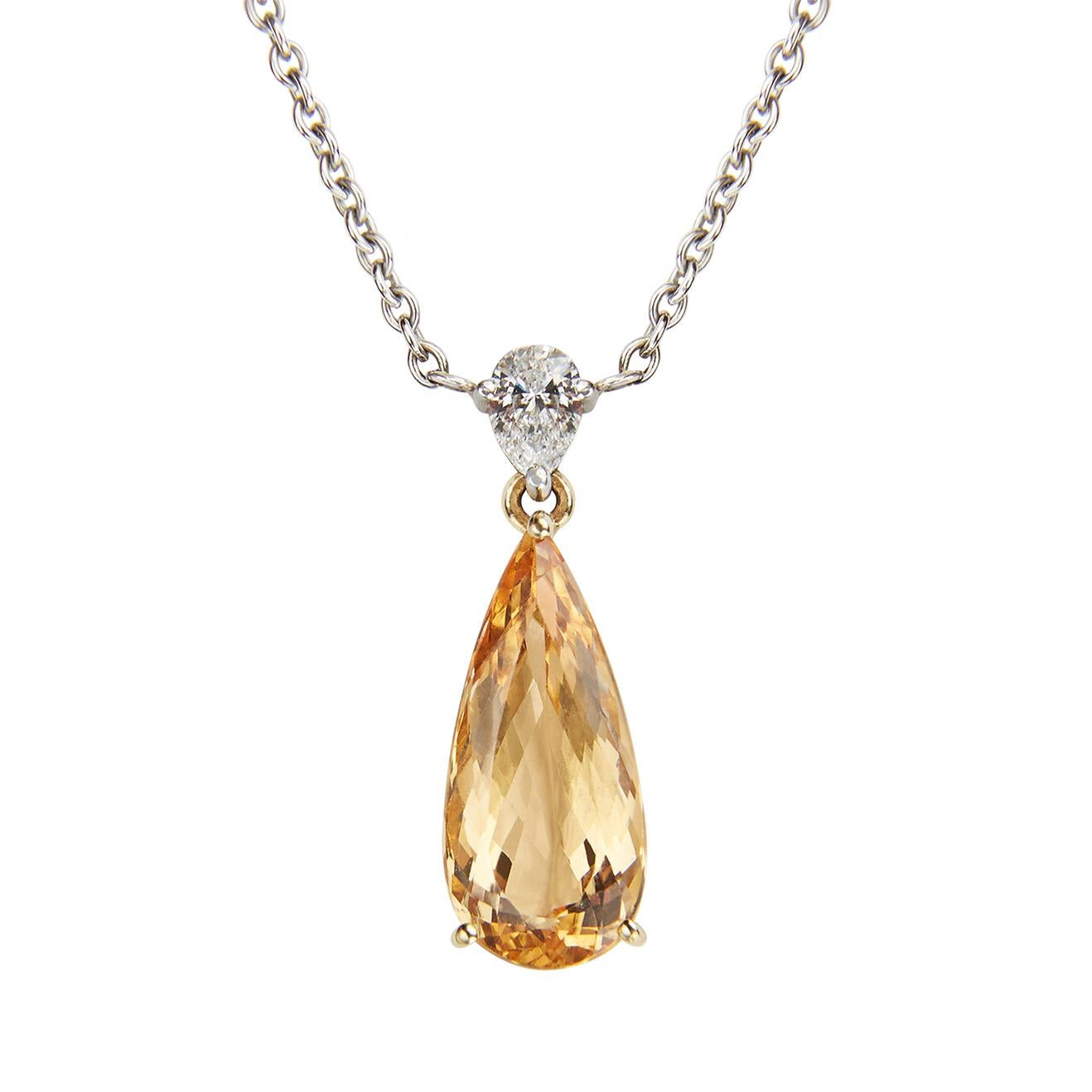 A pear shape topaz set below a pear shape diamond in the Hirsh Wallace setting.

- 1 Imperial topaz weighing 3.81 carats
- 1 pear shape diamond weighing 0.21 carats
- Handmade in platinum and 18K yellow gold in our Mayfair atelier

Formed deep