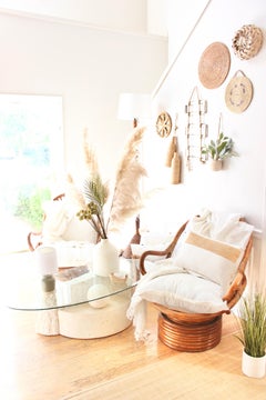 His and Her 1960s Rattan Swivel Chair Pair Weightless Rock & 360 Swivel