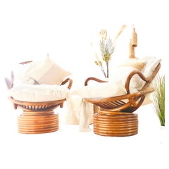 Used His and Her 1960s Rattan Swivel Chair Pair Weightless Rock & 360 Swivel