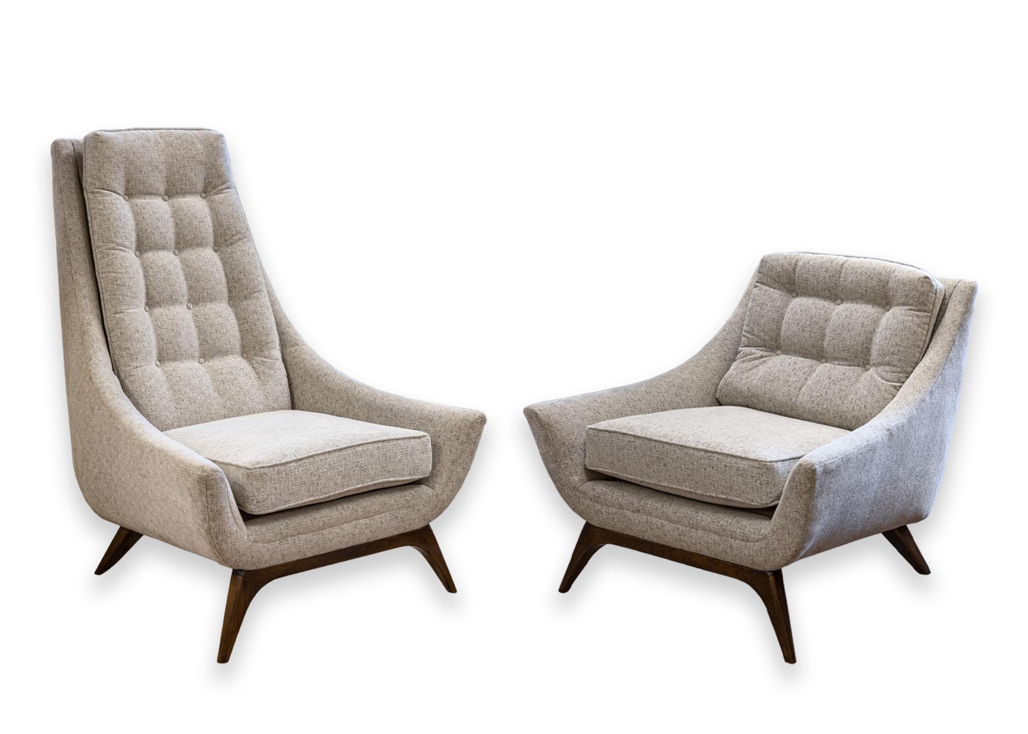 A his and hers Adrian Pearsall style set of accent chairs. A gorgeous set of reupholstered chairs featuring a lovely grey tufted fabric, and walnut legs. Each chair is a different size and proportion, his and hers. The tall chair features a long