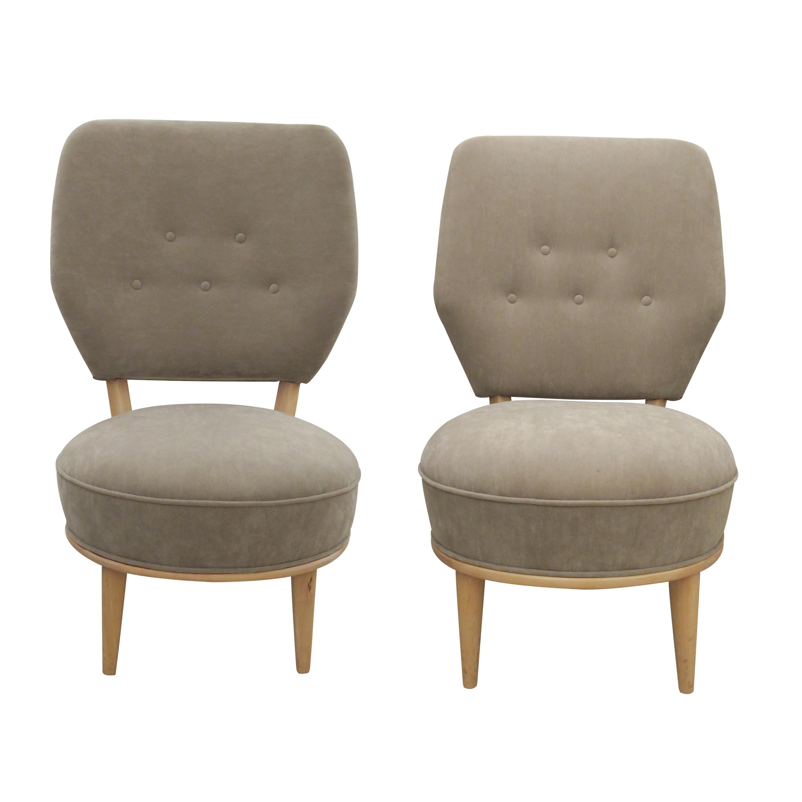 Mid-Century elegant His and Hers pair of easy chairs with a large comfortable backrest and a smooth birch wood frame with elegant curves, “His” chair is 3 cm higher than “Hers”. The chairs have been re-upholstered in a suede-like washable durable