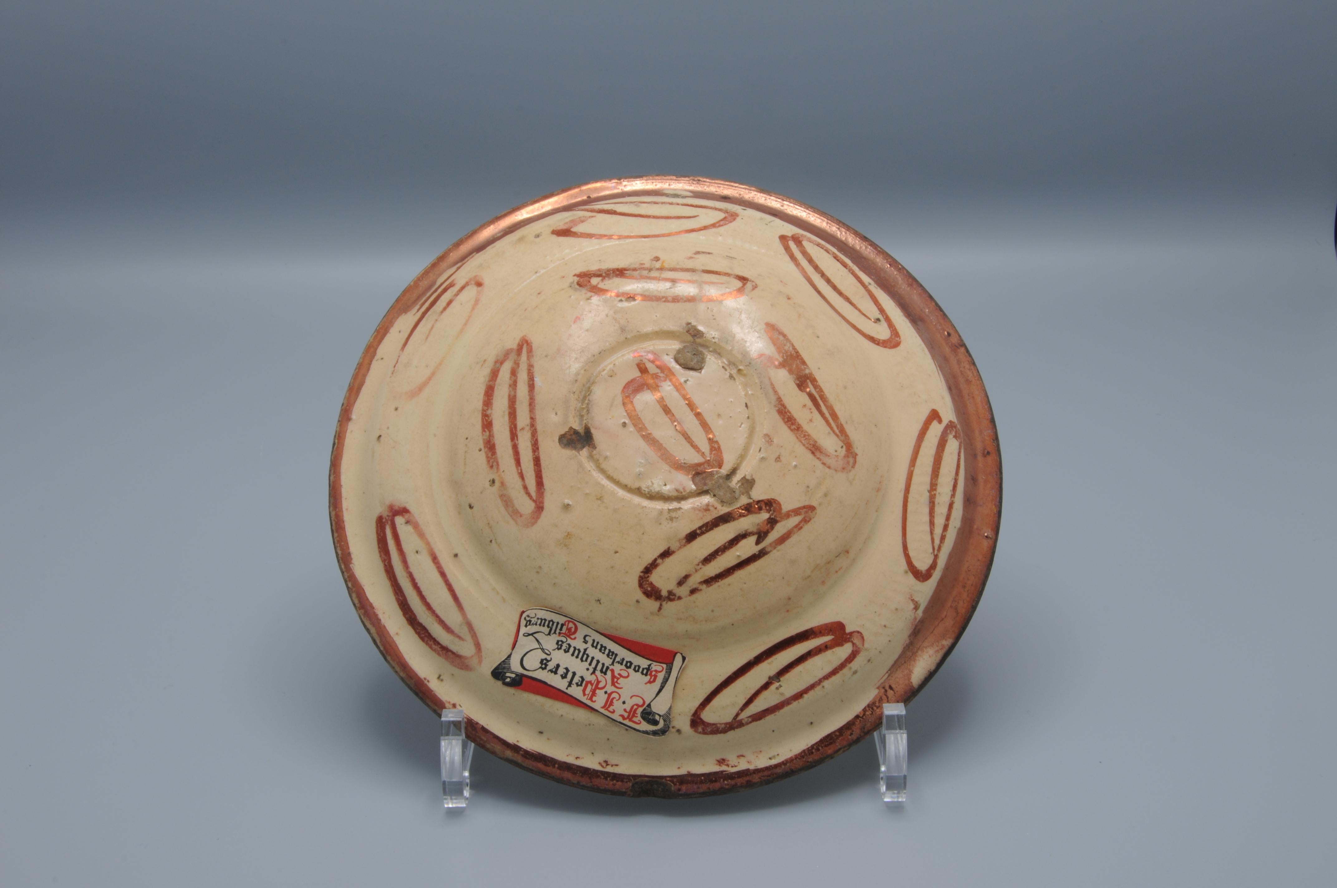 17th century Hispano-Moresque lusterware bowl or charger with a central tree of life motif.
The tin-glazed lusterware produced at Manises near Valencia, Muel, and Catalonia shows the passing of Islamic artistic influence into Christian Spain.

In