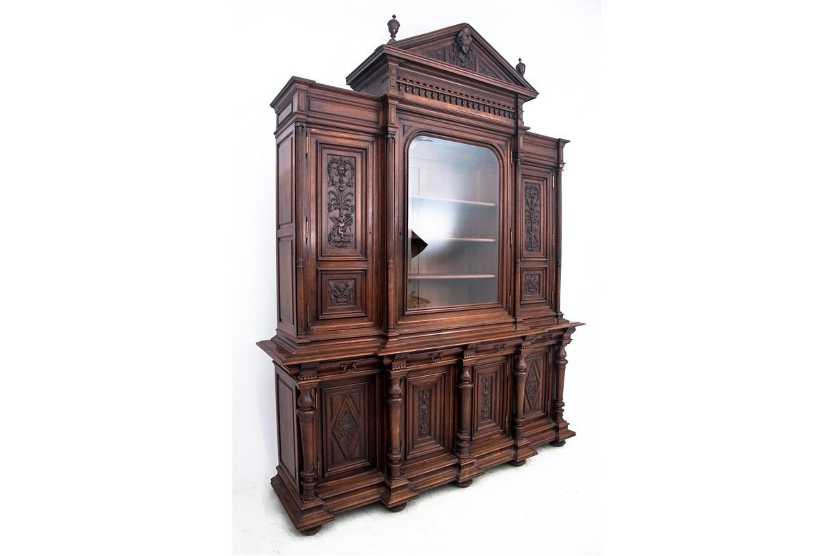 A historic cupboard from the end of the 19th century circa 1870 from France. Beautiful carvings. Preserved in very good condition. In our workshop the surfaces were polished and restored. Made of walnut wood. 
dimensions: height: 325 cm, width: 255