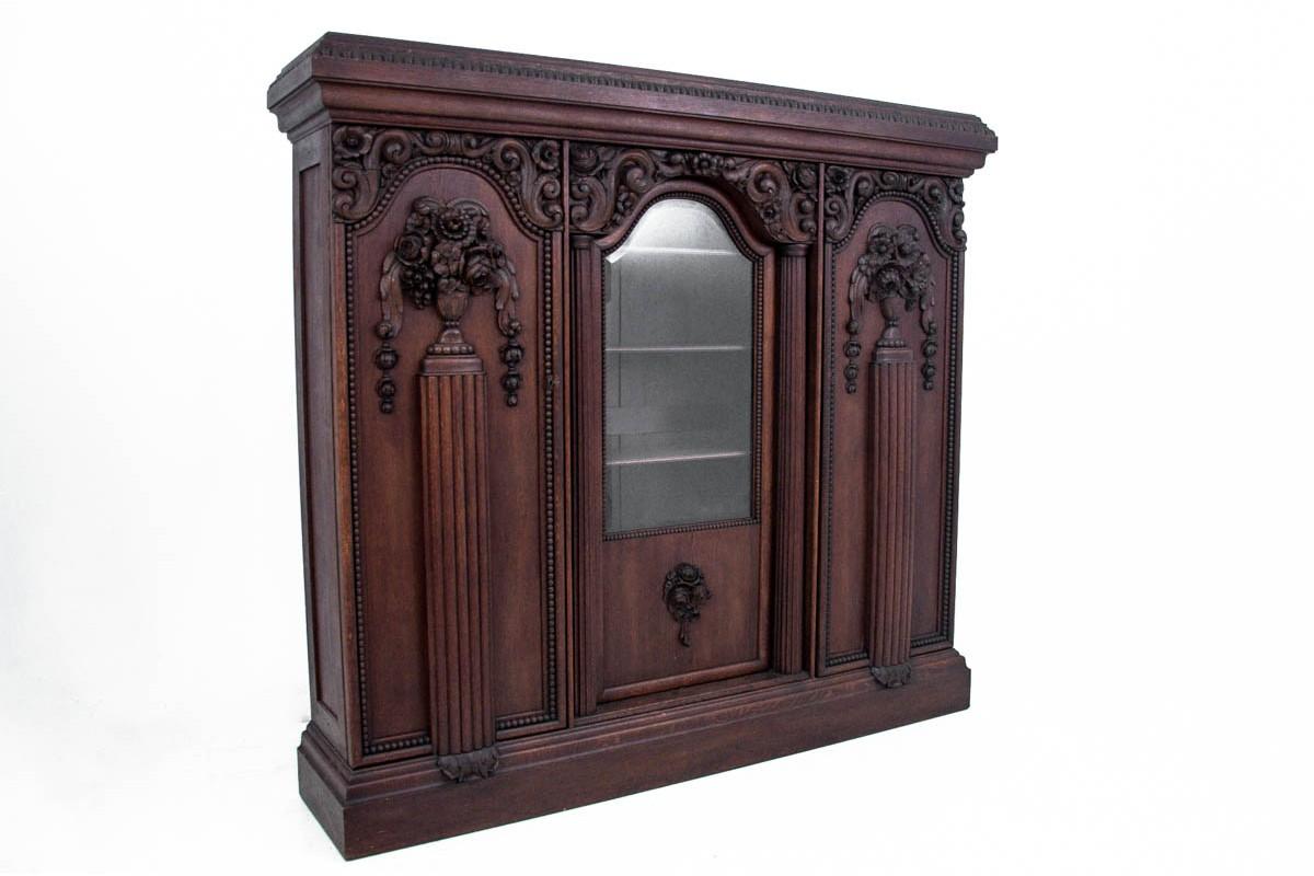 An antique office from the beginning of the 20th century.

Dimensions:

Library: height 214 cm / width 234 cm / depth 52.5 cm

Desk: height 80 cm / width 175 cm / depth 86 cm.